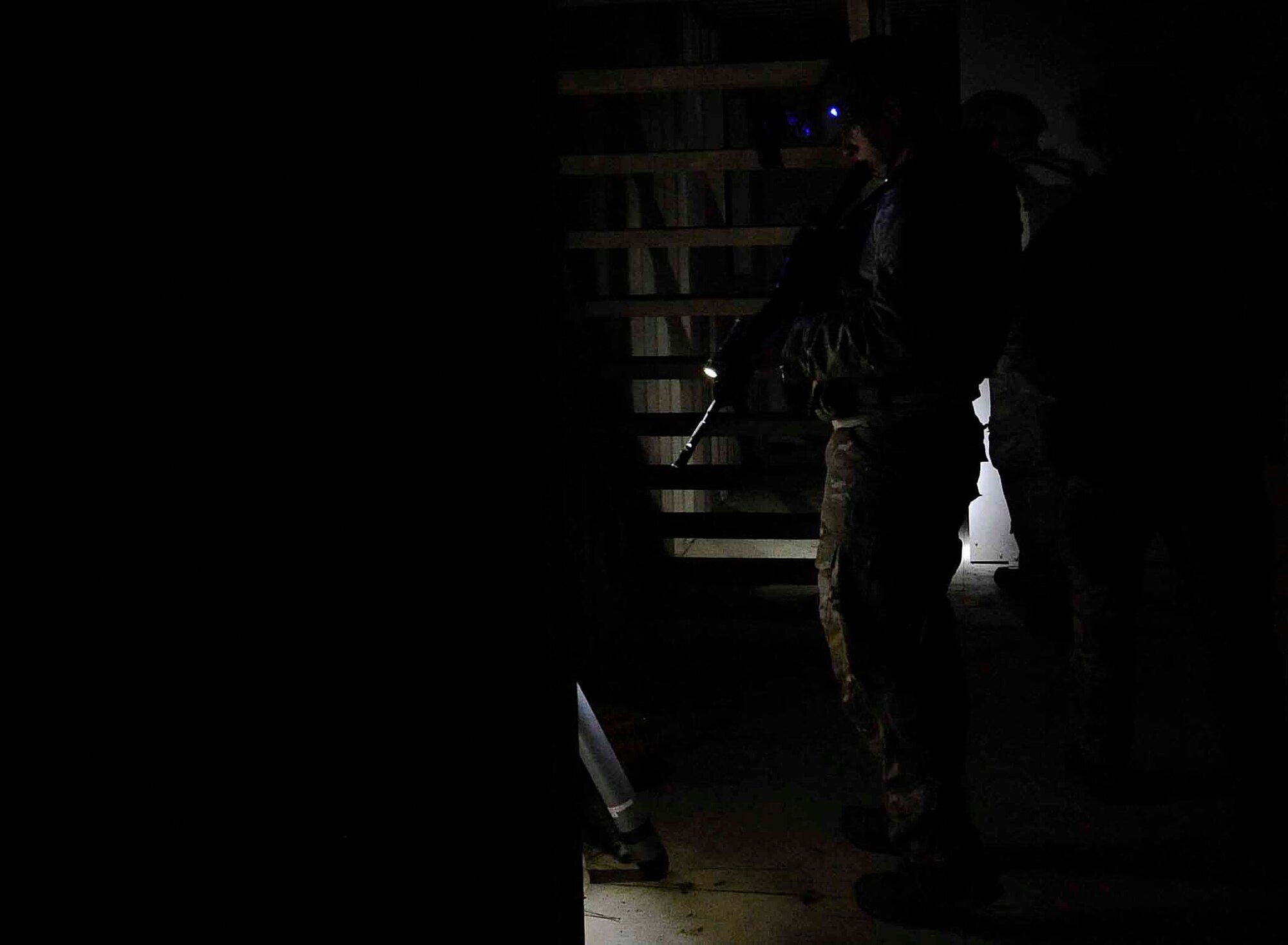 The 1st Special Operations Civil Engineer Squadron explosive ordnance disposal team searches a bunker for explosives at Hurlburt Field, Fla., April 24, 2014. The team was training for a hostage situation involving bombs. (U.S. Air Force photo/Airman 1st Class Andrea Posey)