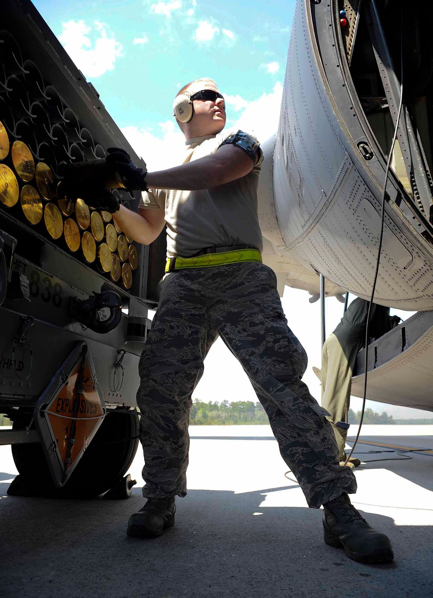 Senior Airman Ryan Hudalla, 1st Special Operations Equipment Maintenance Squadron munitions line delivery crew chief, unloads ammunition shells at Hurlburt Field, Fla., April 23, 2014. The munitions flight provides storage, assembly, delivery, inspection and control of conventional munitions. (U.S. Air Force photo/Airman 1st Class Andrea Posey)