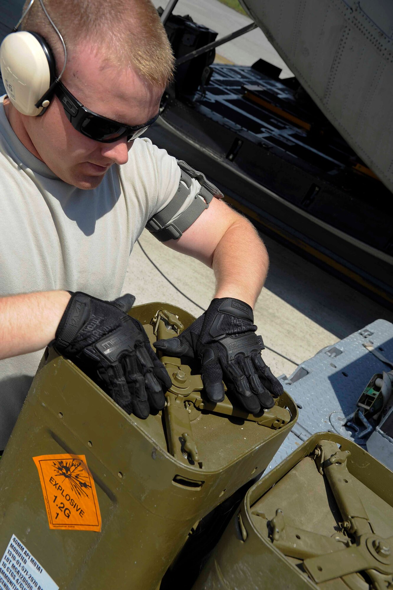 Senior Airman Ryan Hudalla, 1st Special Operations Equipment Maintenance Squadron munitions line delivery crew chief, reseals ammunition containers at Hurlburt Field, Fla., April 23, 2014. The 1st SOEMS is dedicated to providing Hurlburt Field with the best quality in maintenance, ensuring the wing can accomplish its mission. (U.S. Air Force photo/Airman 1st Class Andrea Posey)