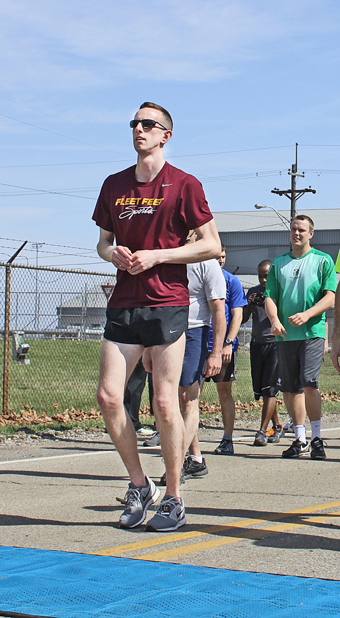 Andy Schweitzer limbers up before the 5K. He would go on to be the overall winner, running at a  pace of 5.31 miles an hour. About 275 people registered in advance for the run and 25 more came on race day.