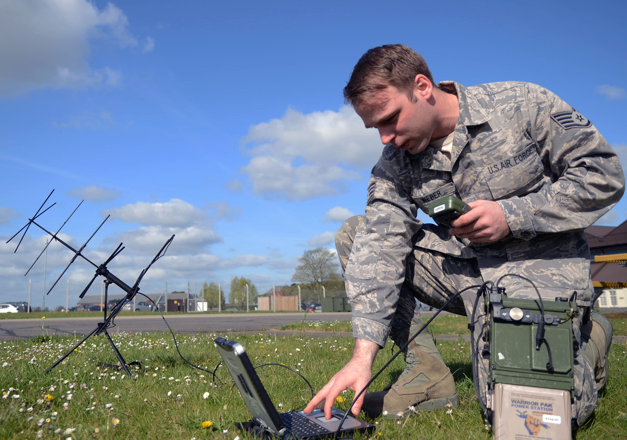 U.S. Air Force Staff Sgt. Nathaniel Weber, 321st Special Tactics Squadron radio frequency transmission systems craftsman from Lacrosse, Wis., operates a satellite messaging terminal April 15, 2014, on RAF Mildenhall, England. Weber earned the Square D Spotlight for exhibiting the Air Force Core Value of Excellence in All We Do. (U.S. Air Force photo by Airman 1st Class Kyla Gifford/Released)