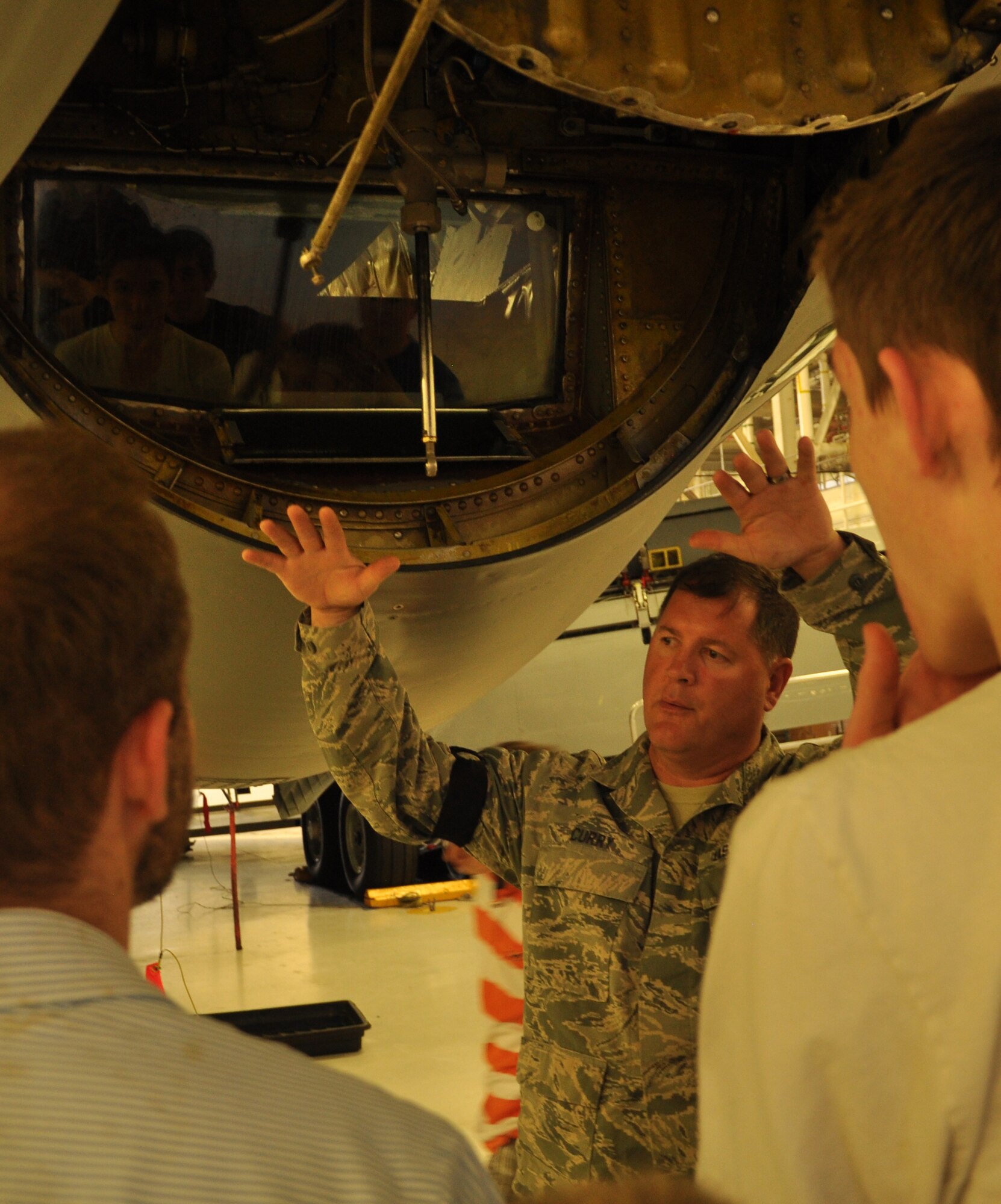 Senior Master Sgt. Martin Curry, 931st Maintenance Squadron, shows a group of Boy Scouts the aft of a KC-135 Stratotanker with the boom removed for repairs at the Periodic Inspection dock of McConnell Air Force Base, Kan., April 23. The tour was sponsored by the 931st Air Refueling Group's Deputy Commander for Maintenance, Lt. Col. Christopher Labrum. The scouts visited the McConnell Air Force Base Flight Simulator and the PE dock to learn about the air refueling and maintenance total force initiative mission. (Air Force photo by Master Sgt. Brannen Parrish)