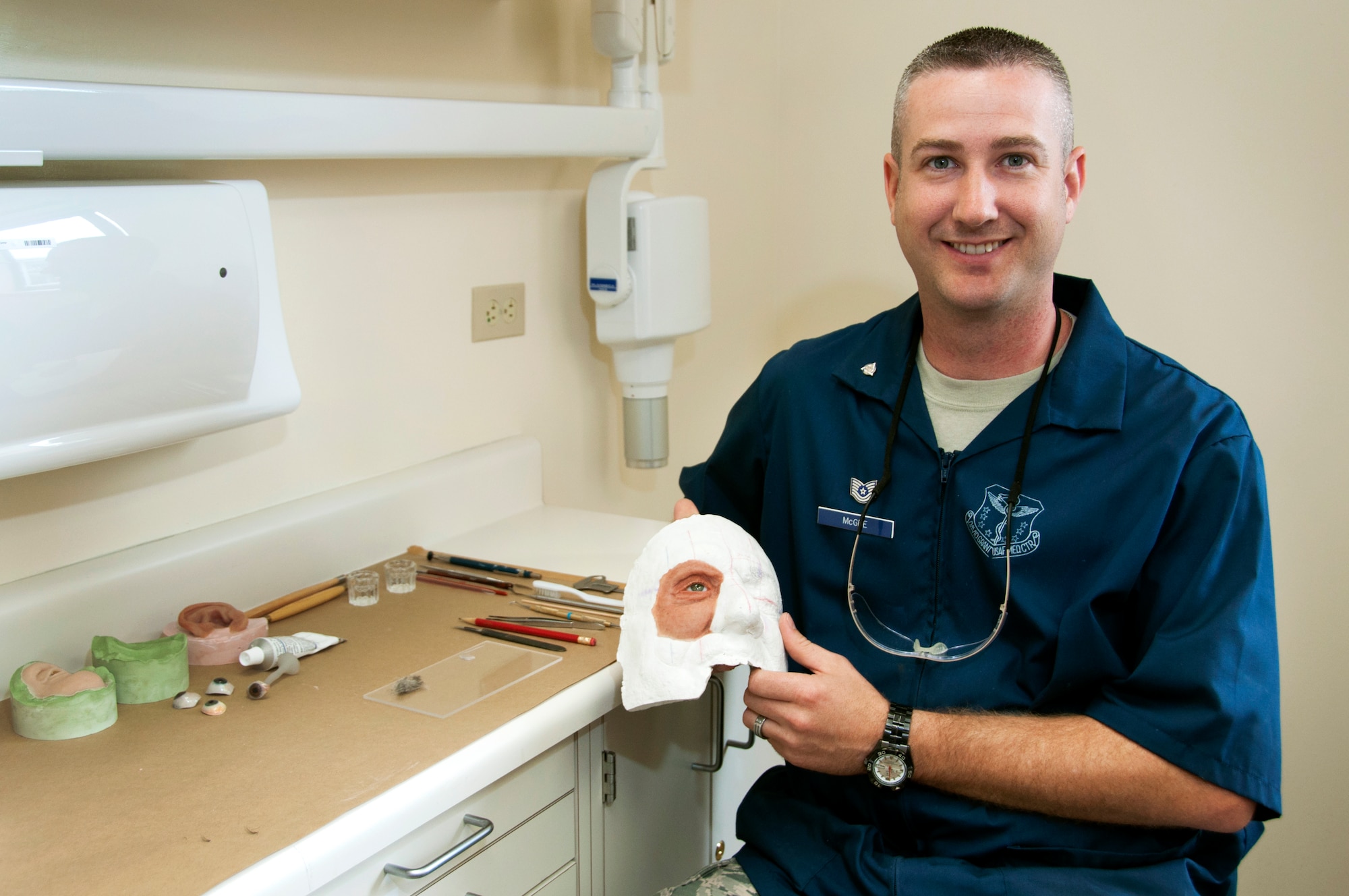 Tech. Sgt. Tim McGee, 60th Dental Squadron maxillofacial laboratory technician, displays a prosthetic he has been working on Monday in the David Grant USAF Medical Center Dental Clinic.(U.S. Air Force photo/Staff Sgt. Patrick Harrower)