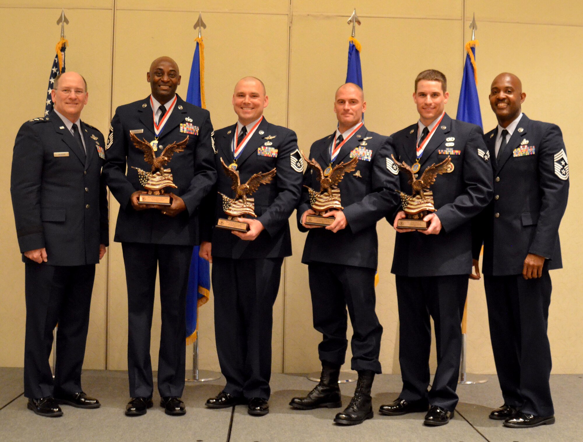 From left: Lt. Gen. James F. Jackson, Air Force Reserve Command commander, with the 2013 Outstanding Airmen of the Year, Senior Master Sgt. Eric Smith, (First Sergeant), Master Sgt Patrick Hampton (Senior NCO), Tech Sgt. William Posch (NCO), and Senior Airman Tyler Mohr (Airman), and AFRC Command Chief Master Sgt. Cameron B. Kirksey. (U.S. Air Force photo/Senior Master Sgt. Minnie Jones)