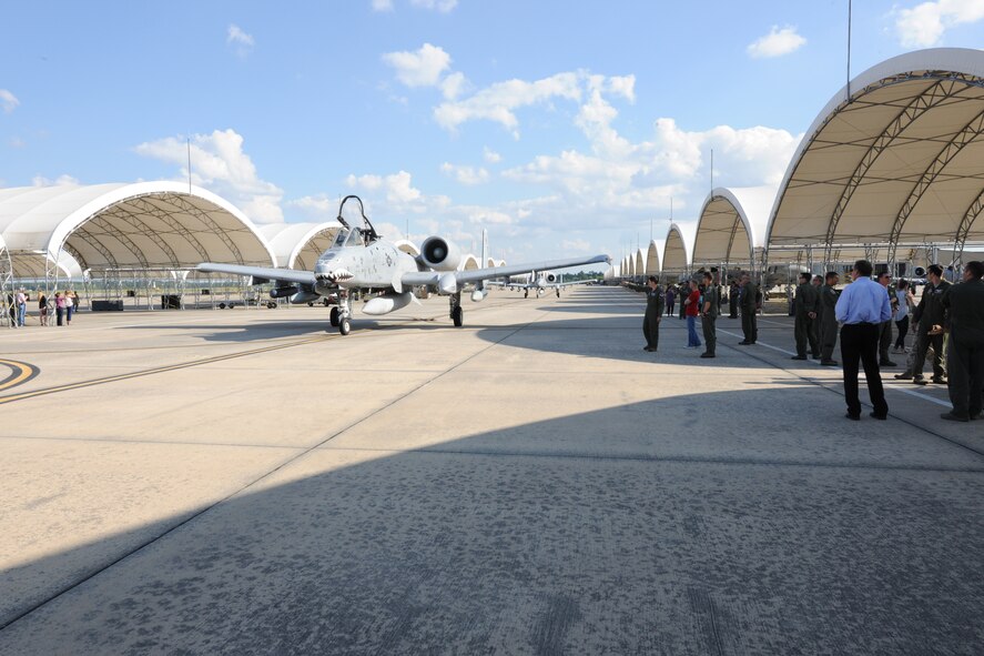 An A-10C Thunderbolt II returns from deployment while friends and families of the aircrew wait on the pilots’ arrival April 23, 2014, at Moody Air Force Base, Ga.  The returning pilots are assigned to the 75th Fighter Squadron and spent six months deployed to Bagram Airfield, Afghanistan. (U.S. Air Force photo by Master Sgt. Sonny Cohrs/Released)