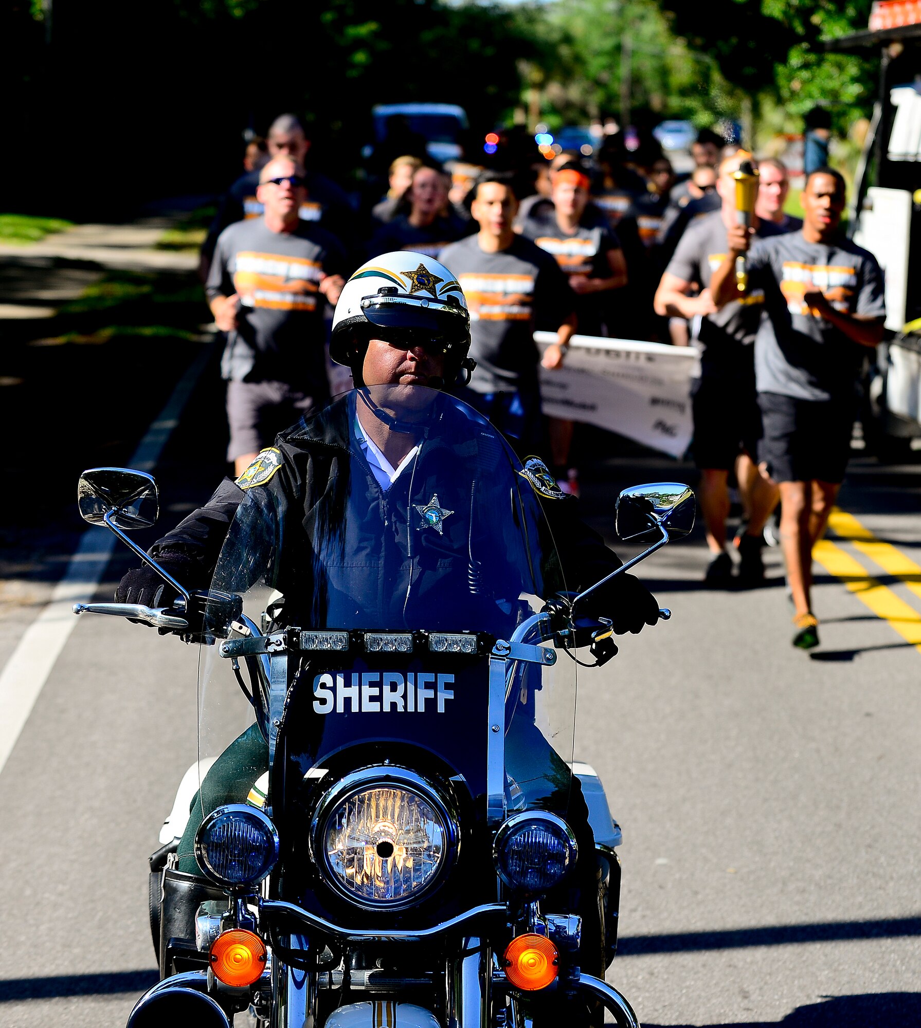 A Hillsborough County police officer serves as an escort during the Law Enforcement torch run, April 16, 2014 at MacDill Air Force Base, Fla. More than 300 law enforcement agencies statewide will play a role in the 31st annual Special Olympics Florida LETR. (U.S. Air Force photo by Senior Airman Melanie Bulow-Gonterman/Released)