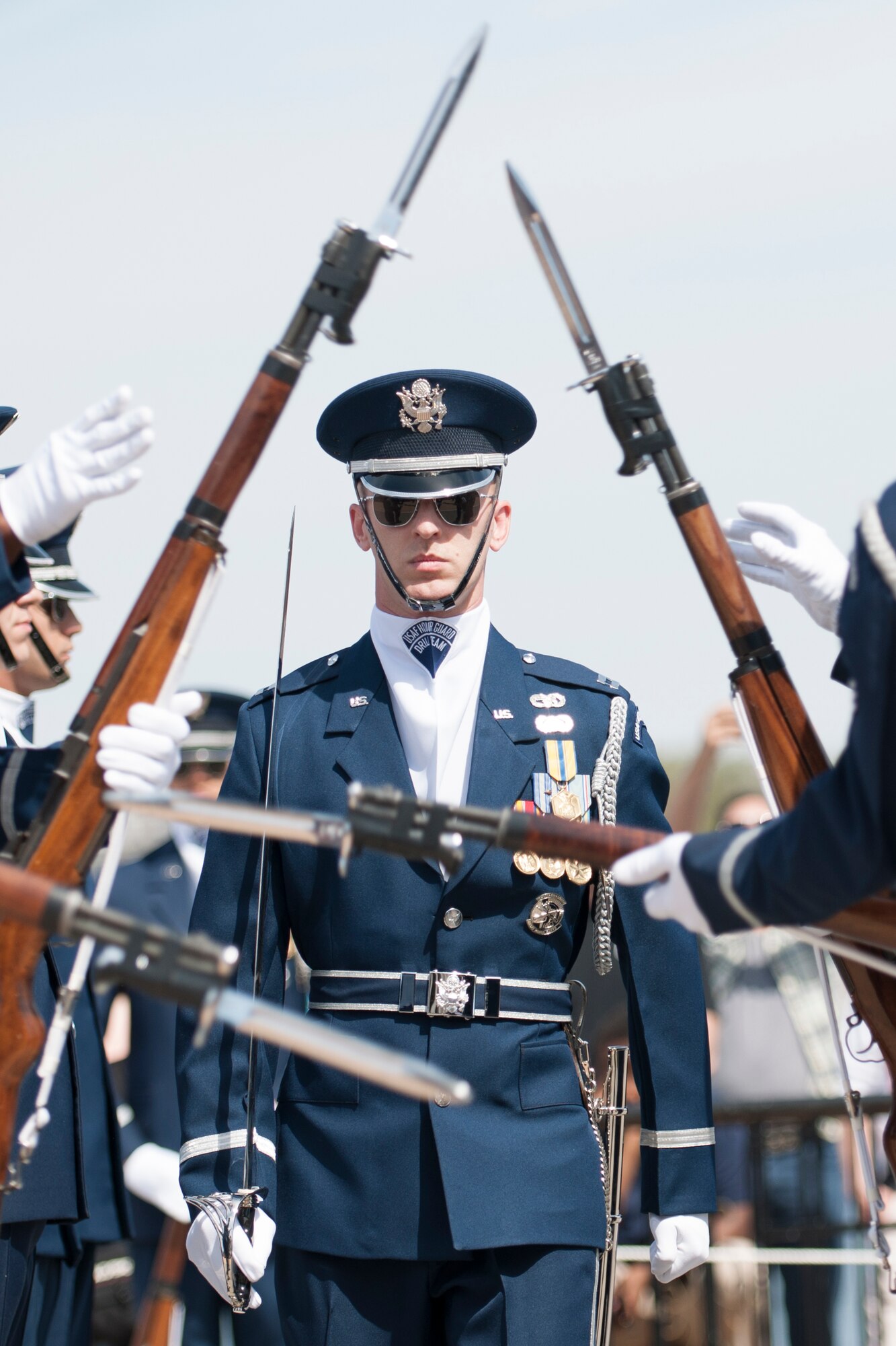 Captain Alan Morford, U.S. Air Force Honor Guard Drill Team commander moves through a gauntlet of spinning rifles during the Joint Service Drill Exhibition, April 12, 2014, at the Jefferson Memorial in Washington, D.C. (U.S. Air Force Photo/Staff Sgt. Robert Cloys)