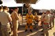 Lt. Col. Jeff Klosky is congratulated by members of the 380th Expeditionary Aircraft Maintenance Squadron and the 99th Expeditionary Reconnaissance Squadron following his flight April 20, 2014, at an undisclosed location in Southwest Asia.  The flight marked Klosky’s 2,500th hour of flight in the U-2. (U.S. Air Force photo byTech. Sgt. Russ Scalf/Released)