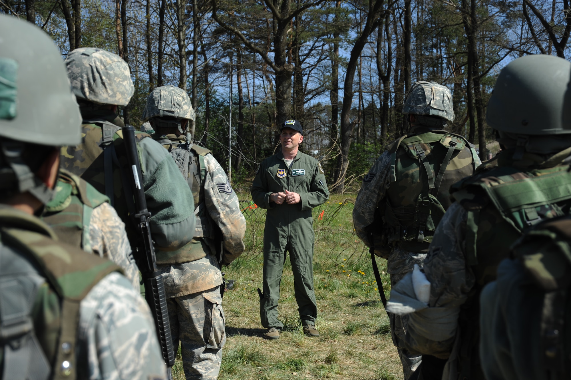 U.S. Air Force Col. Robert Winkler, 52nd Operations Group commander, speaks to Airmen going through a combat readiness training exercise April 17, 2014, at Spangdahlem Air Base, Germany.  Daily training along with CRT helps the 606th Air Control Squadron stay deployment-ready.  (U.S. Air Force photo by Airman 1st Class Dylan Nuckolls/Released)