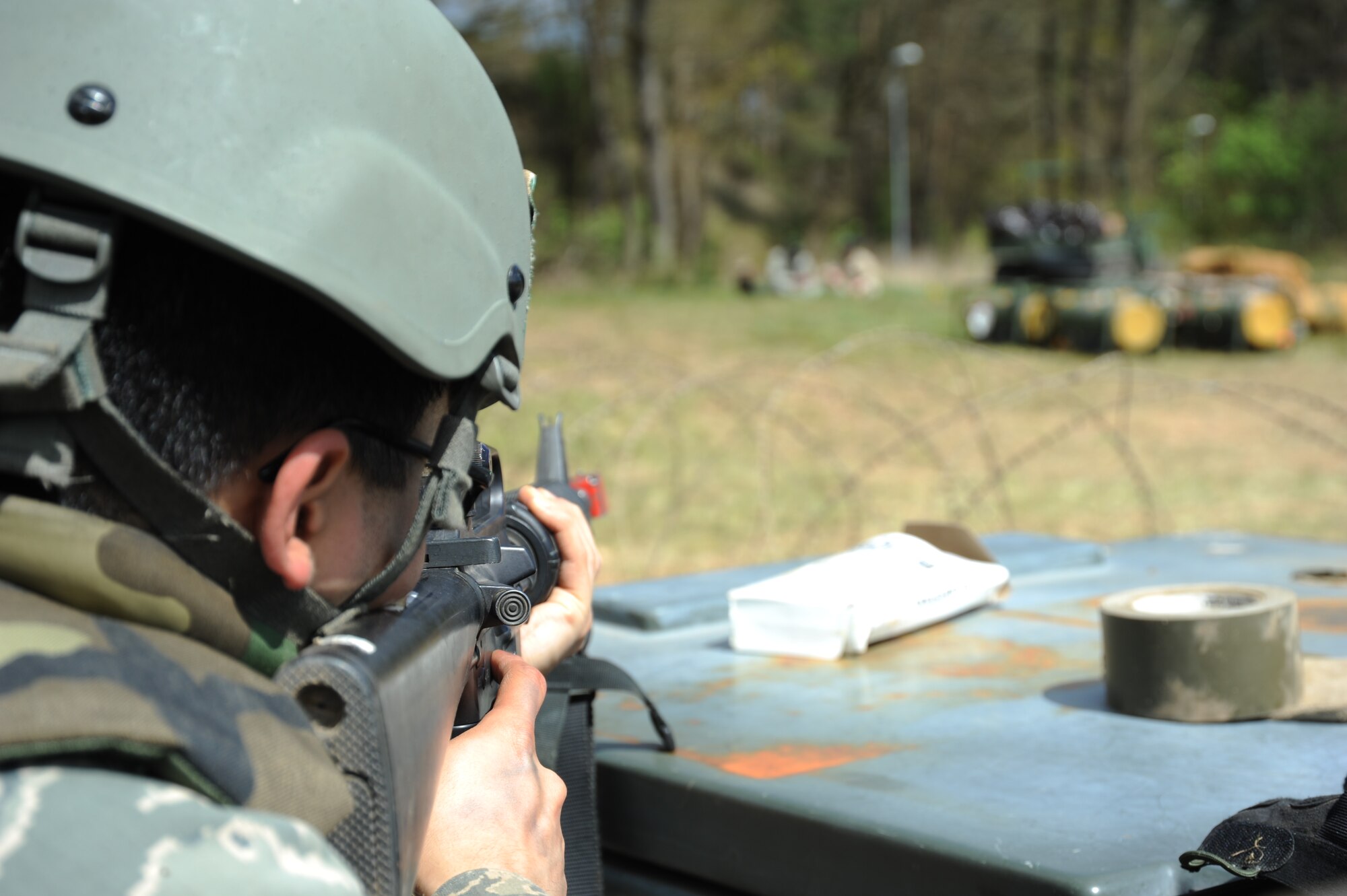 A U.S. Air Force Airman from the 606th Air Control Squadron performs entry control point duty during a combat readiness training exercise April 18, 2014, at Spangdahlem Air Base, Germany.  Airmen on ECP duty performed searches on individuals who wanted to gain entrance to the base. (U.S. Air Force photo by Airman 1st Class Dylan Nuckolls/Released)