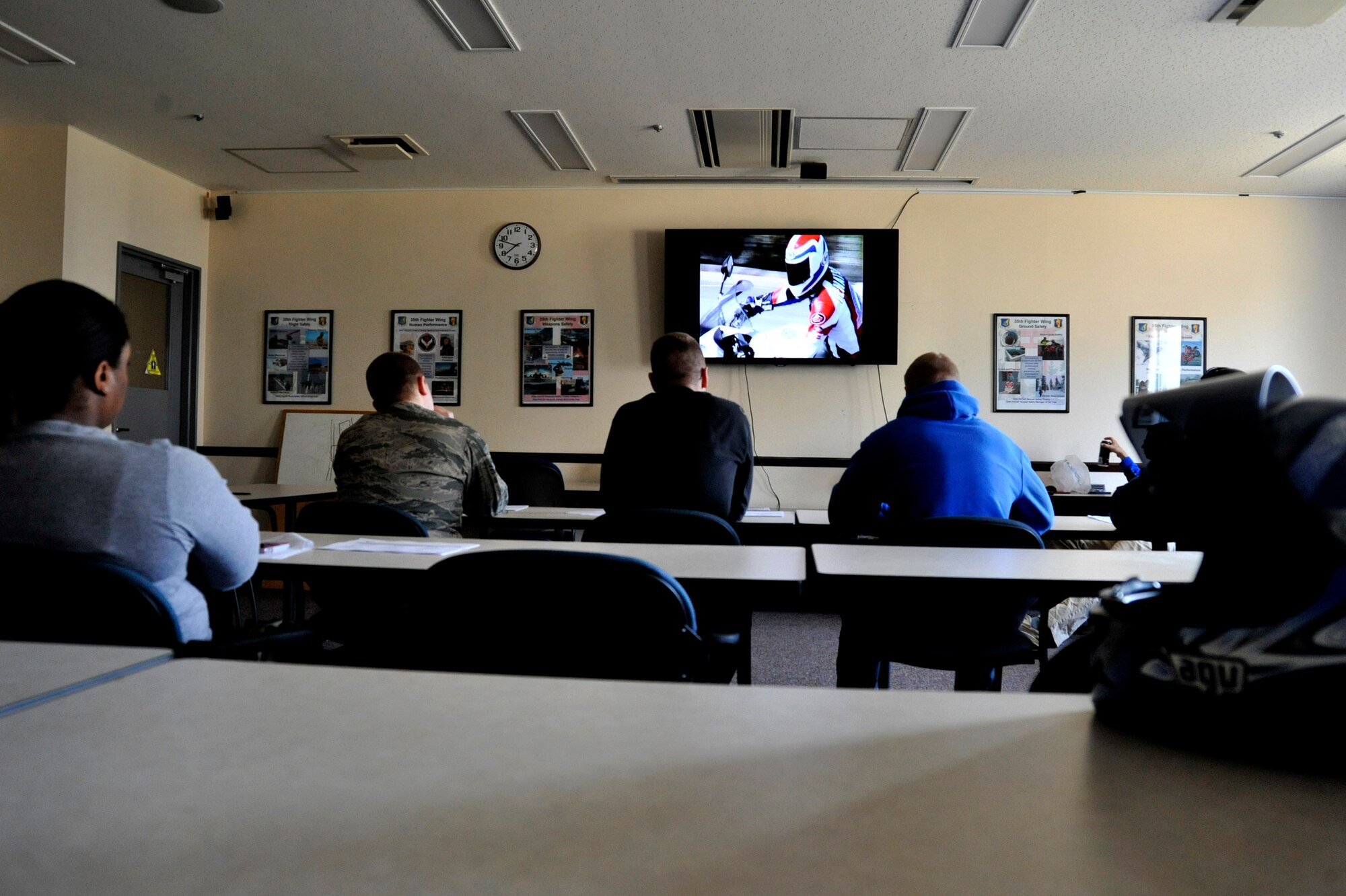 MISAWA AIR BASE, Japan – Misawa Airmen watch a safety video during a sportsbike riders safety course at Misawa Air Base, Japan, April 22, 2014. Instructors go over pre-ride inspection, how to identify risk, emergency braking, cornering techniques, and changes in Air Force regulations. (U.S. Air Force photo/ Staff Sgt. Tong Duong.)