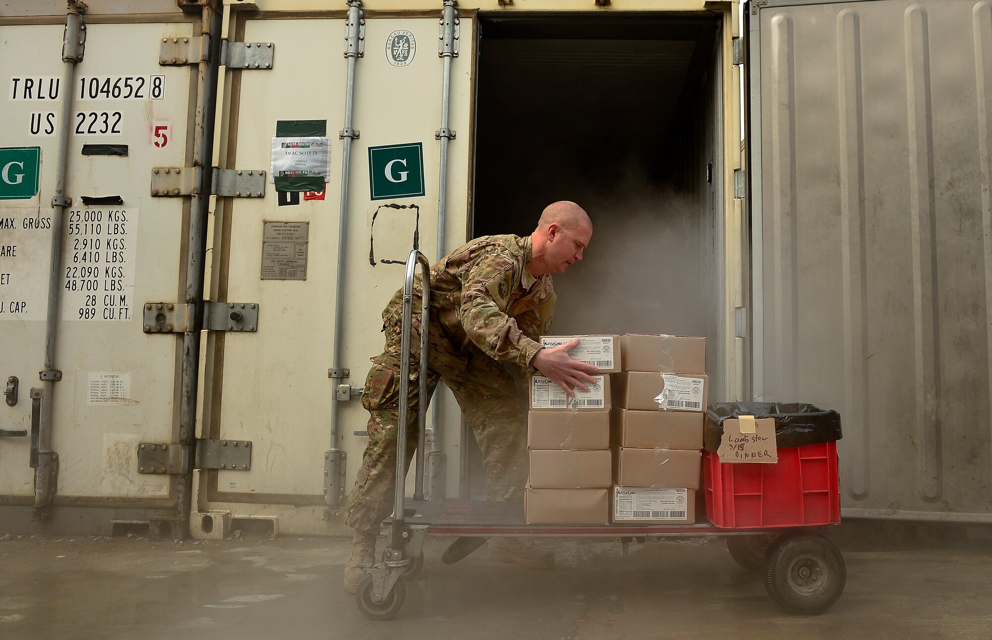 U.S. Air Force Master Sgt. Patrick Noppenberg, 466th Air Expeditionary Squadron noncommissioned officer in charge of food services, organizes lunch food items, March 15, 2014. Noppenberg is responsible for ordering food, receiving and restocking supplies for a kitchen that provides about 1500 meals a day for personnel assigned to Kandahar Air Field. The Dallas, Texas, native is deployed from the 7th Force Support Squadron, Dyess Air Force Base, Texas. More than 1,200 Operation Enduring Freedom Airmen are deployed in Joint Expeditionary Tasking and Individual Augmentee-status to conduct non-traditional Air Force missions with joint-service partners throughout Afghanistan. Noppenberg and more than 350 other Airmen serve in JET/IA positions throughout Afghanistan's Regional Command South, Southwest and West attached to the U.S. Air Force 466th Air Expeditionary Squadron at Kandahar. (U.S. Air Force photo by Staff Sgt. Vernon Young Jr.)
