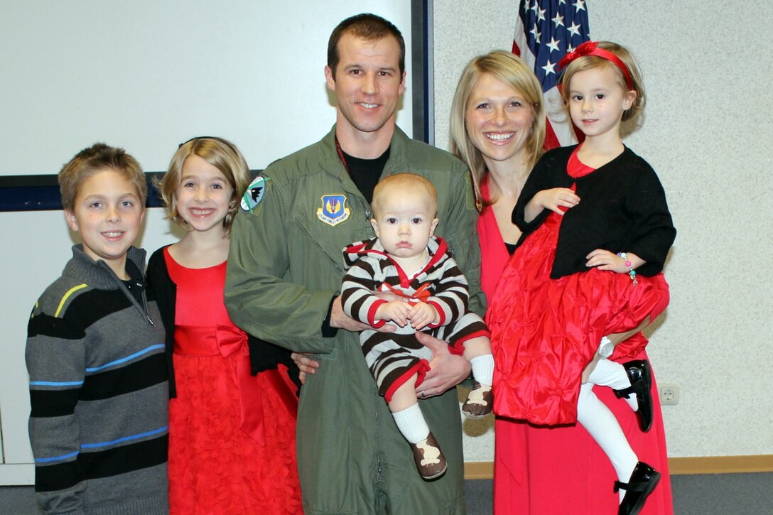 U.S. Air Force Maj. Bradley Sullivan, 480th Fighter Squadron F-16 Fighting Falcon pilot, Spangdahlem Air Base, Germany, stands with his wife Jenny and their four children in 2014, including his daughter Chloe (pictured far right). Both Jenny and Sullivan lost their first spouses to cancer and were single parents until they married in 2011. (Courtesy Photo/Released)