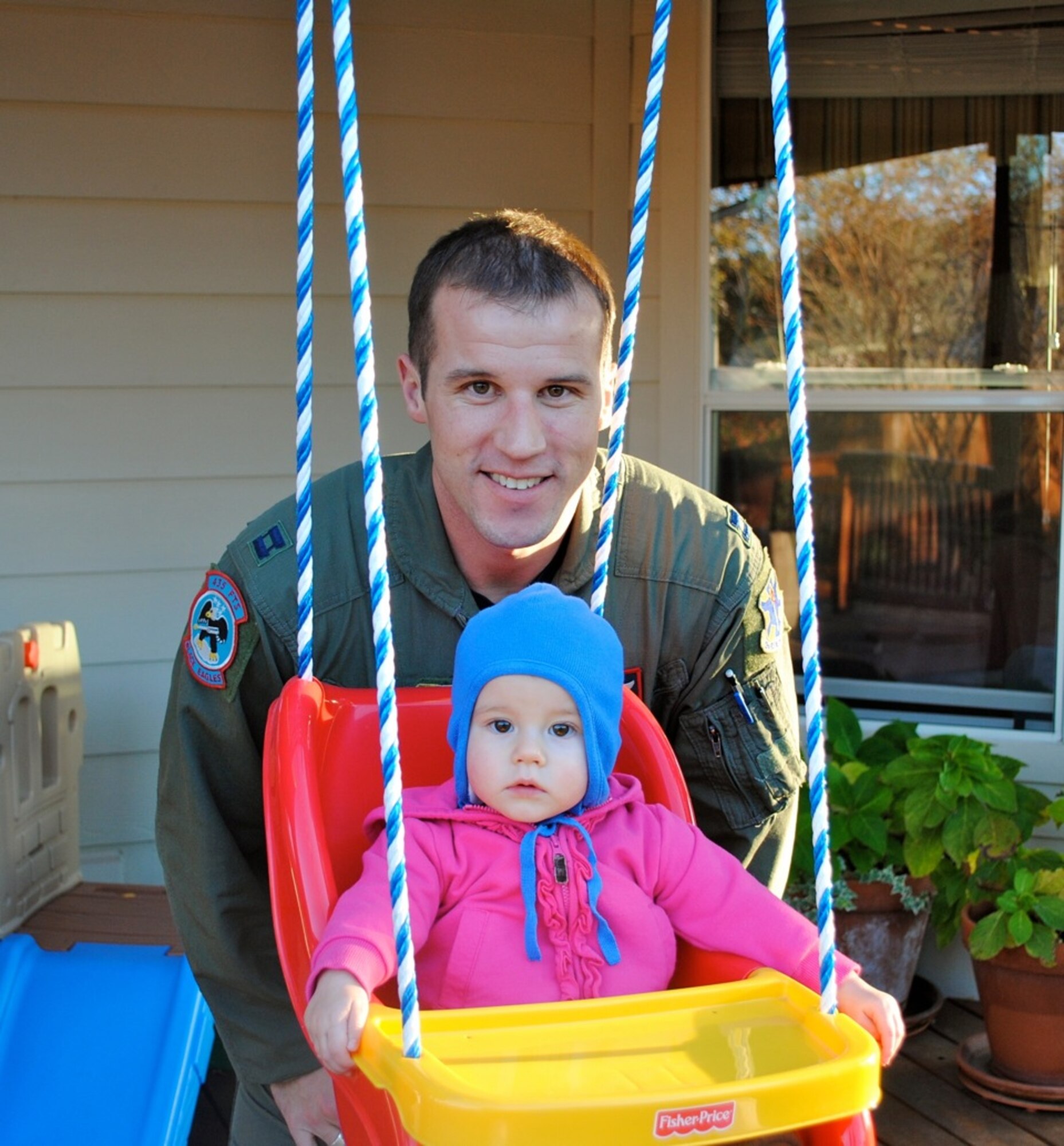 U.S. Air Force Maj. Bradley Sullivan, 480th Fighter Squadron F-16 Fighting Falcon pilot, Spangdahlem Air Base, is pictured here in 2010 with his one-year-old daughter Chloe Grace at a friend’s house, near Randolph Air Force Base, Texas. Sullivan was a single parent after his wife Sara passed away from breast cancer, two weeks after giving birth to Chloe. (Courtesy Photo/Released)