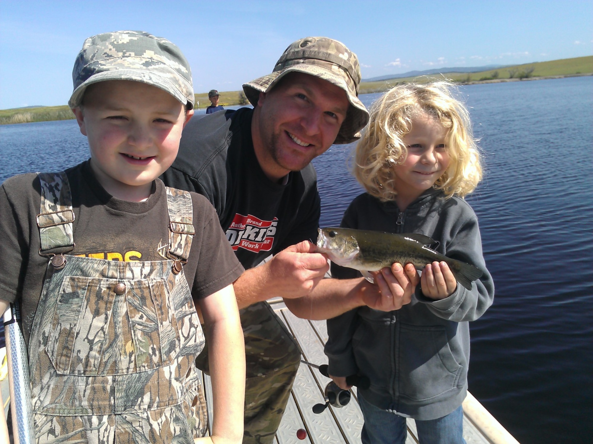 Future anglers pose with their first catch at Beale Air Force Base’s Upper Blackwelder Lake, California. The Air Force recently partnered with the National Park Trust to bring the Buddy Bison Great Outdoors Challenge to military families at several installations. The program encourages children and families to spend less time in front of a screen and more time outdoors. (Courtesy photo)
