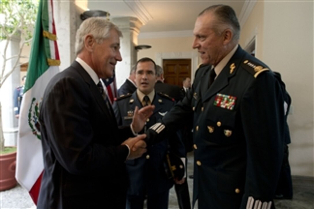 U.S. Defense Secretary Chuck Hagel thanks Secretary of National Defense Gen. Salvador Zepeda Cienfuegos in Mexico City, April 24, 2014. Hagel participated in the ministerial meeting with Mexico, Canada and the United States to discuss issues of mutual importance with defense counterparts.  Hagel participated in the second North American Defense Ministerial conference, which brought together the defense leaders from the United States, Canada and Mexico.