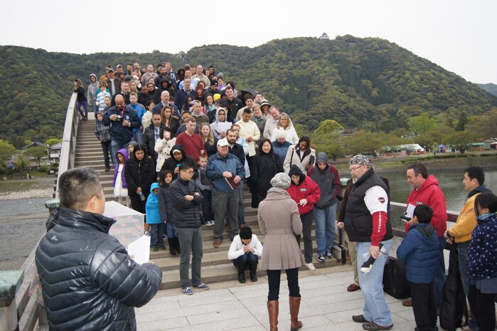 Lt. Cmdr. Louis Lee, command chaplain with the Marine Memorial Chapel, speaks to members attending the Easter Sunrise Service at the Kintai Bridge in Iwakuni, Japan, April 20, 2014. The purpose of the service was to reflect on the principles of Easter and to bring the community closer together.             