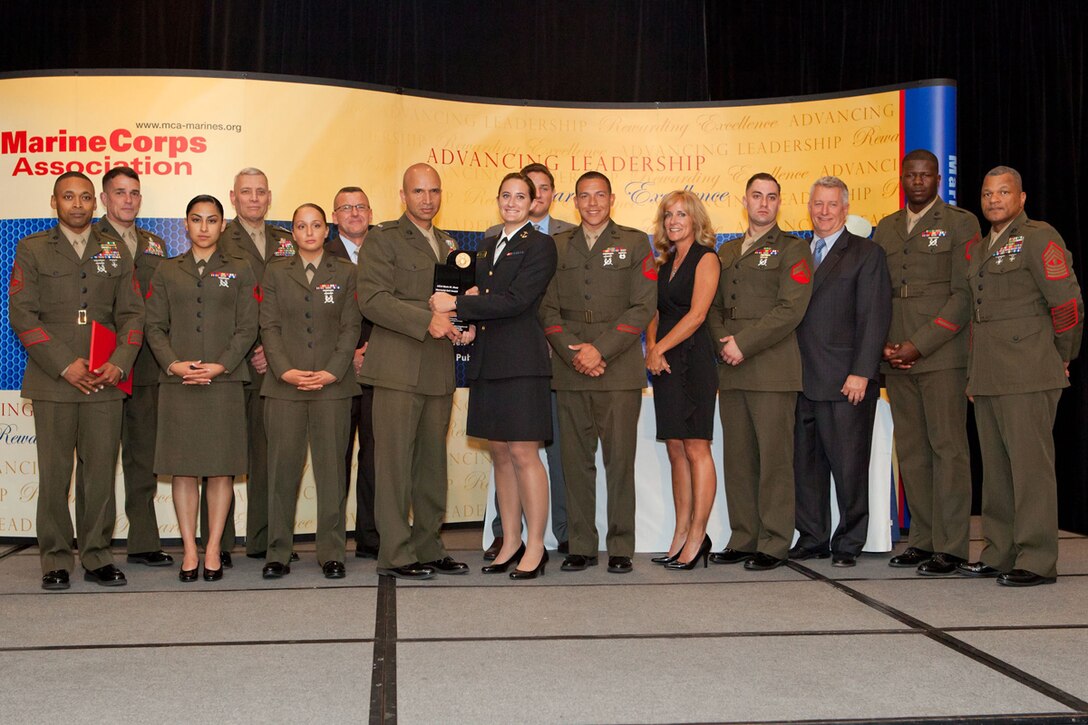 Lieutentant Col. Jaime Macias, the commanding officer of Marine Wing Communications Squadron 28, and other Marines from the squadron received the Lt. Col. Kevin M. Shea Memorial Unit Award during a ceremony in Washington, D.C., April 17, 2014.