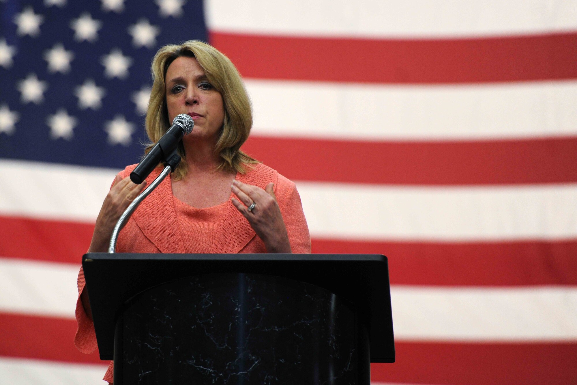 Secretary of the Air Force Deborah Lee James speaks during an all call, April 23, 2014, at Altus Air Force Base, Okla. James addressed various topics such as sequestration, force structure and Air Force core values. James also spoke about the fiscal environment and what it means for service members before taking questions from the audience. (U.S. Air Force photo/Senior Airman Jesse Lopez) 