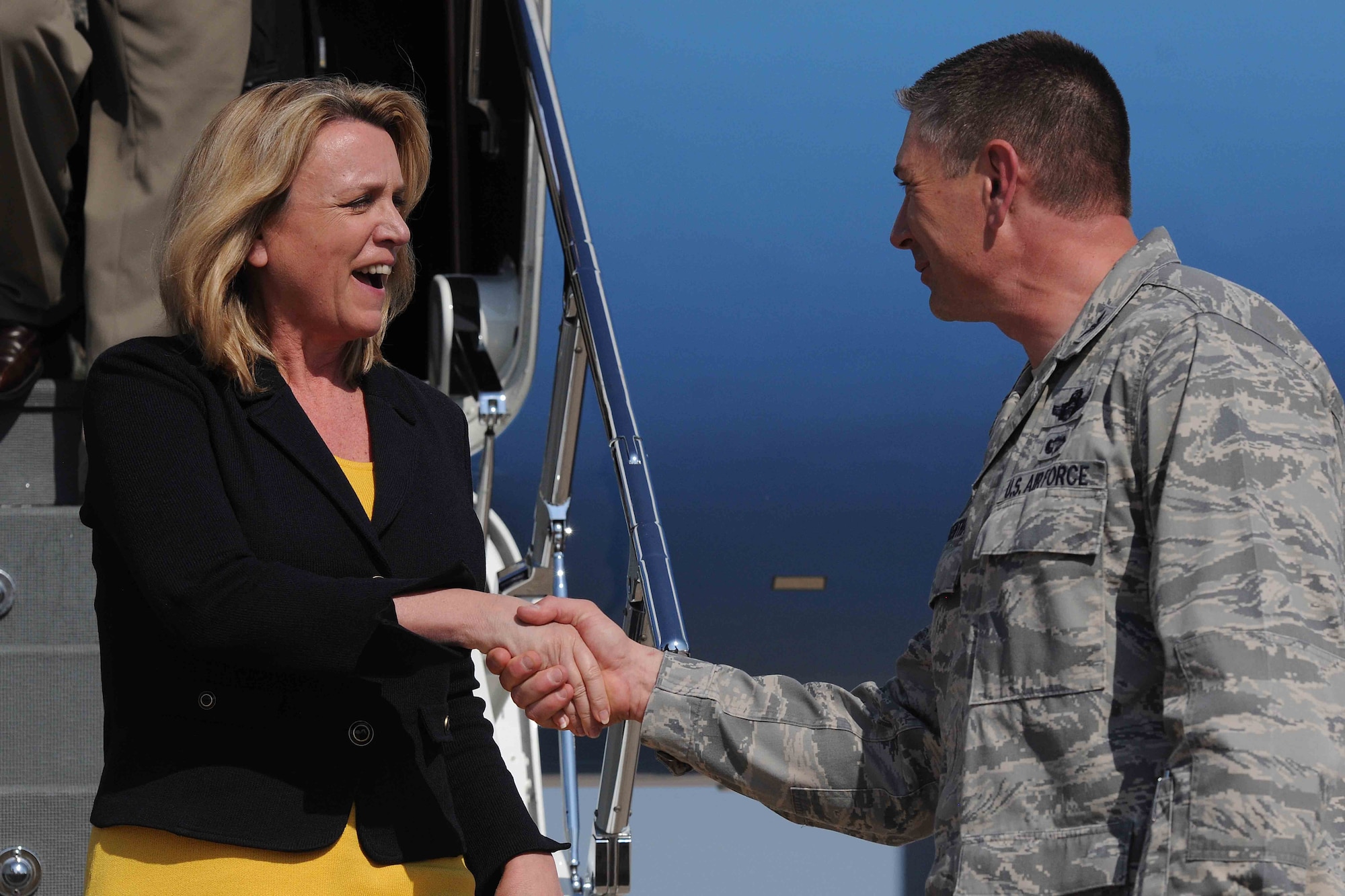 Secretary of the Air Force Deborah Lee James is greeted by Col. Bill Spangenthal during a base visit, April 23 , 2014, at Altus Air Force Base, Okla. James conducted a base visit with Altus AFB Airmen to get a firsthand view of the base’s mission and initiatives. Spangenthal is the 97th Mobility Wing commander. (U.S. Air Force photo/Senior Airman Jesse Lopez)