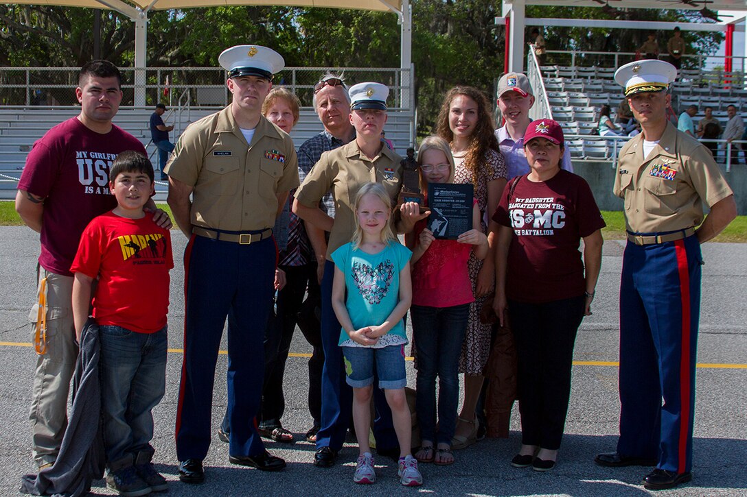 MARINES CORPS RECRUIT DEPOT PARRIS ISLAND, S.C. – Lt. Col. Chad E. Hoare, executive officer of 6th 
Marine Corps District Headquarters (far right), stands with Sgt. Richard J. Whelan, recruiter from Recruiting Substation Gastonia, Recruiting Station Columbia, as well as Pfc. Amanda P. Nieminem, honor graduate of platoon 4012, and her family after graduation here, April 25, 2014.  Nieminem, a native of Gastonia, N.C., was also the company high shooter with a score of 337 out of 350. (Official Marine Corps photo by Lance Cpl. John-Paul Imbody)
