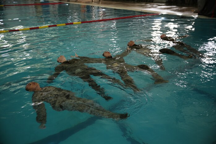 Company K recruits start the water tread test during Water Survival Basic Qualification aboard the depot, March 31. Recruits had to perform the technique for four minutes in order to pass.