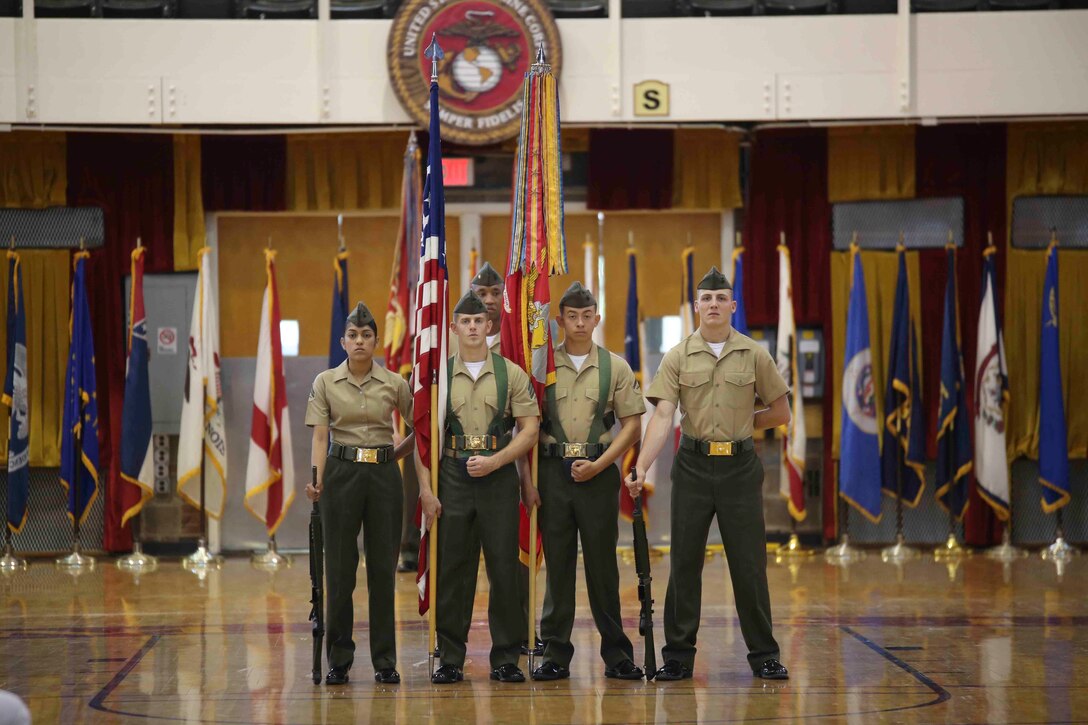 The 10th Marine Regiment color guard, stands at parade rest proudly displaying the newly rededicated battle colors during a ceremony April 25, 2014 at the Goettge Field House. The ceremony was held to celebrate the regiment’s 100th anniversary, preserve the history of 10th Marines and to memorialize the regiment’s past through its present Marines and sailors.
