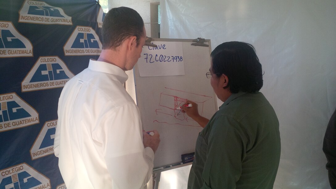 Vince Moody, Hydraulic Engineer at the Hydrologic Engineering Center, discusses the some of the hydraulic modeling concepts covered in the training course with a student.