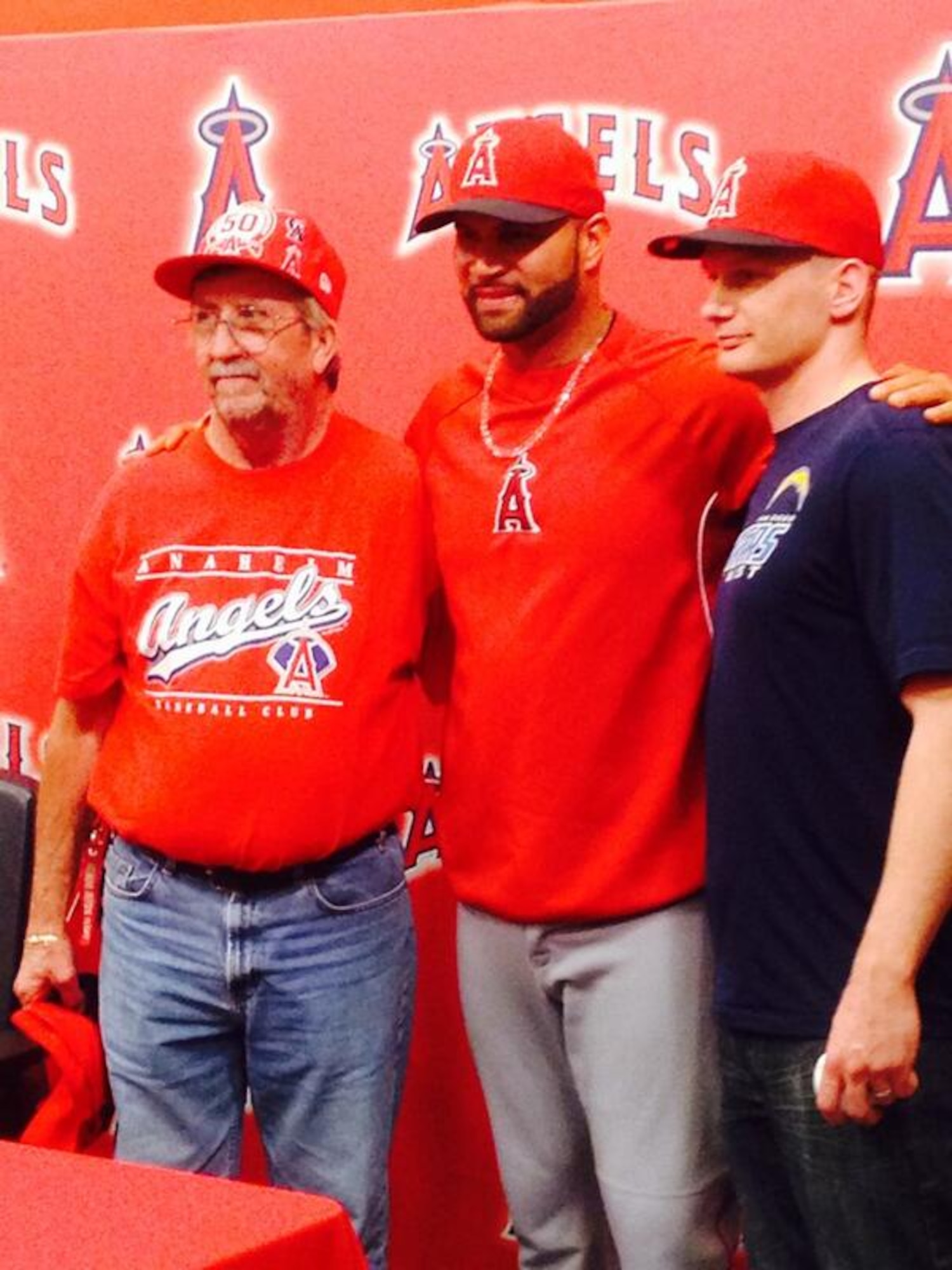 Staff Sgt. Thomas Sherrill (right) stands with Albert Pujols of the Los Angeles Angels of Anaheim after catching Pujols' 500th career major league home run April 22nd, 2014, in Washinton, D.C. Sherrill, a long-time Angels fan, moved into the left-center field bleachers at Nationals Park shortly before Pujols' milestone at bat. (Courtesy photo/Angels Baseball) 