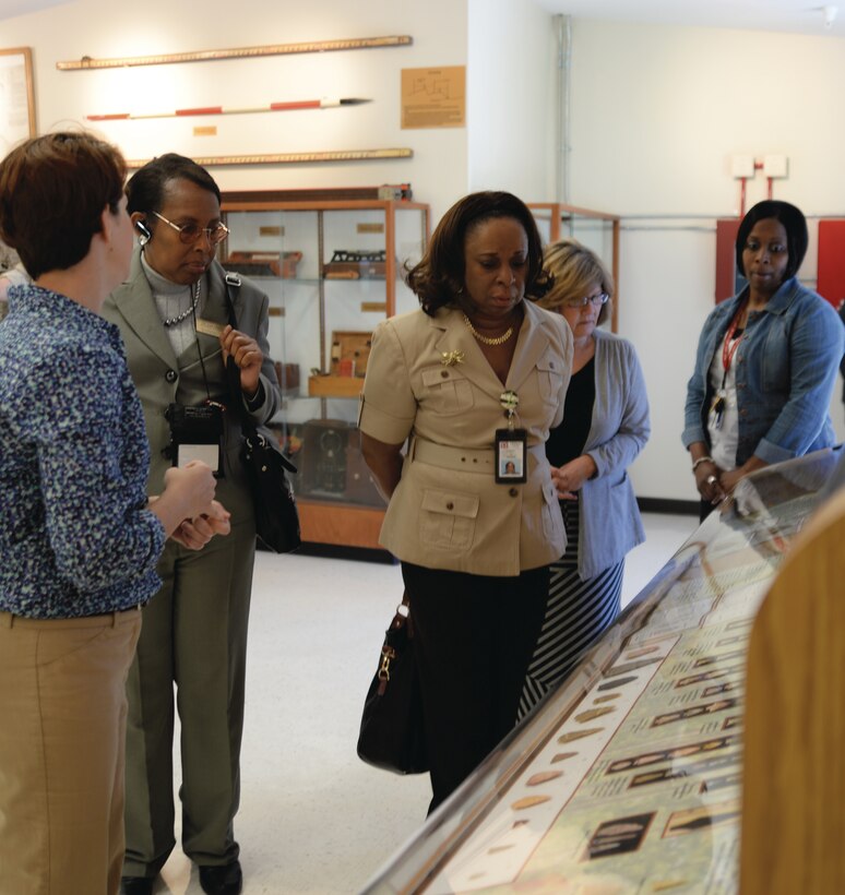 Members of the Dougherty County School System join Marine Corps Logistics Base Albany’s personnel at the ribbon-cutting ceremony and tour the Natural and Cultural Resources Center, Monday.
Julie Robbins, natural resources manager, Installation and Environmental Division, MCLB Albany (left) discussed some of the exhibits on display. Visitors included: Dr. Gail Brown, secondary science content coordinator; Dr. Zeda George, principal and Kristin Williams, international baccalaureate primary year’s program coordinator, both from the International Studies Elementary Charter School in Albany.
