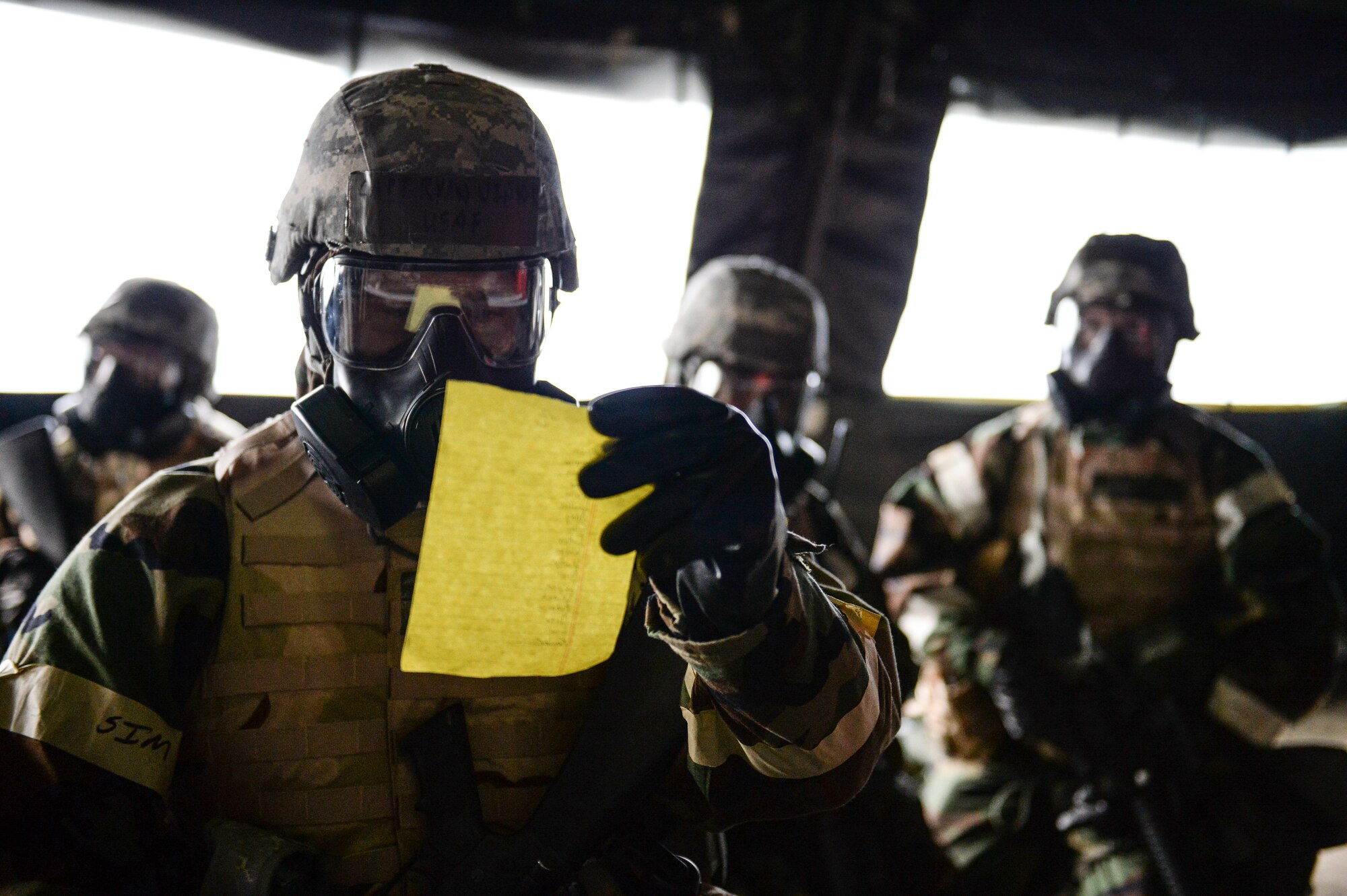 Eielson Icemen conduct an accountability check during Ability to Survive and Operate training April 22, 2014, Eielson Air Force Base, Alaska. After each simulated incident, element leaders ensured personnel accountability before moving to the next phase of actions. (U.S. Air Force photo by Senior Airman Peter Reft/Released)