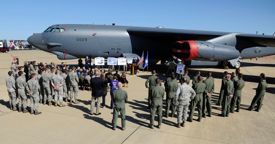 Team Barksdale members attend a ceremony in recognition of a B-52H Stratofortress returning from Tinker Air Force Base, Okla., on the flightline at Barksdale Air Force Base, La., April 25, 2014. The B-52 is the first of its kind to receive a new Combat Network Communications Technology system, complete with state of the art displays, servers and communications uplinks. (U.S. Air Force photo/Senior Airman Joseph A. Pagán Jr.)