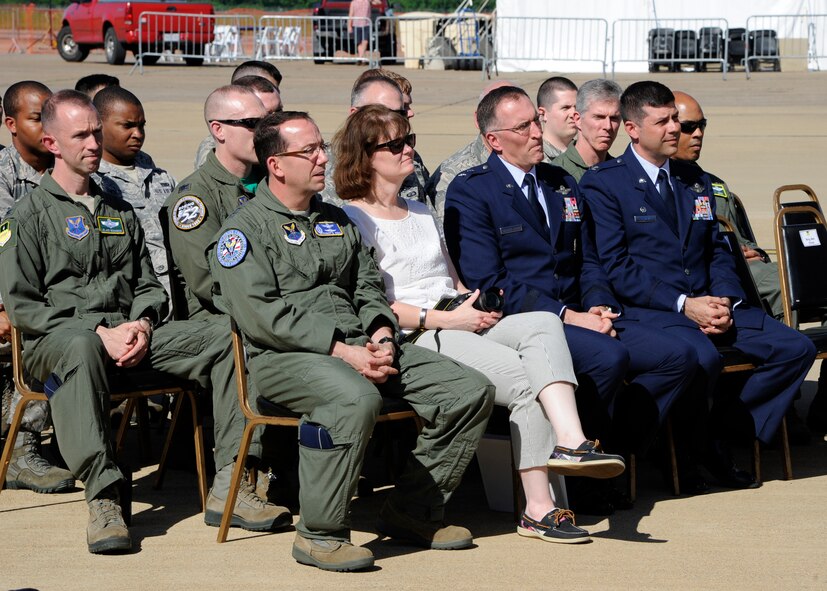 Maj. Gen. Robert Rego, front left, Air Force Global Strike Command vice commander, Maj. Gen. Scott Vander Hamm, center, 8th Air Force commander, and Col. Andrew Gebara, 2nd Bomb Wing commander, listen to the opening remarks for the Combat Network Communications Technology ceremony on the flightline at Barksdale Air Force Base, La., April 25, 2014. The CONECT system will eventually be installed in the entire fleet of B-52H Stratofortress. The new system allows aircrew to receive last-minute updates so they are able to strike the most current or necessary targets rapidly. (U.S. Air Force photo/Senior Airman Joseph A. Pagán Jr.)