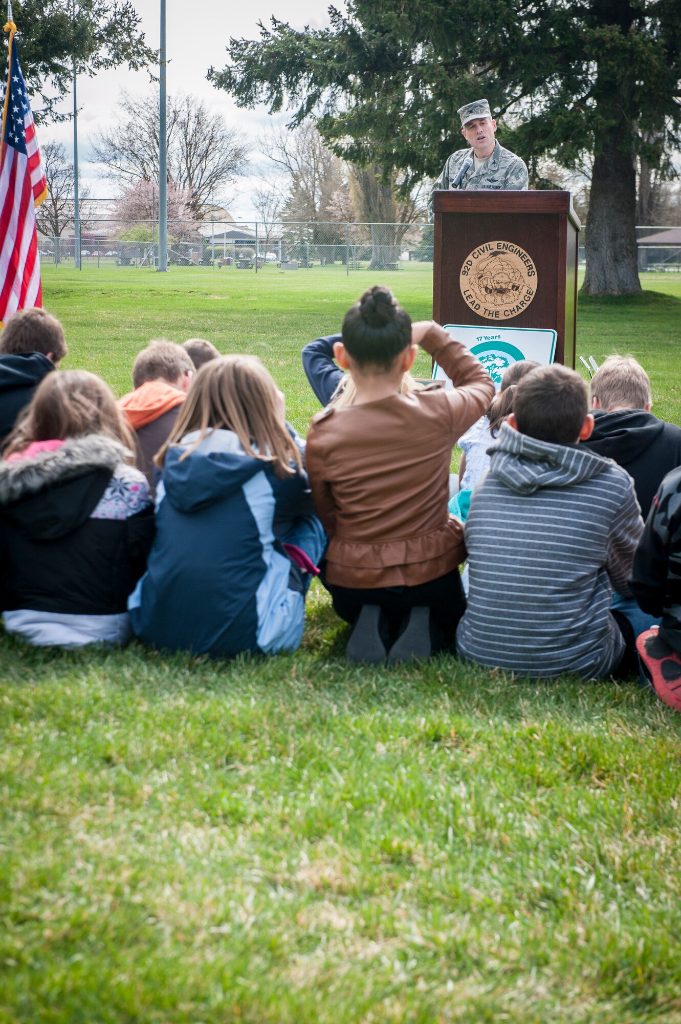 Col. Brian Newberry addresses the crowd during the annual Arbor Day celebration in Miller Park at Fairchild Air Force Base, Wash., April 25, 2014. The base celebrates 20 years as a Tree City USA. This recognizes the base for effectively managing public tree resources and to encourage the implementation of community tree management. Newberry is the 92nd Air Refueling Wing commander. (U.S. Air Force photo by Staff Sgt. Benjamin W. Stratton/Released)