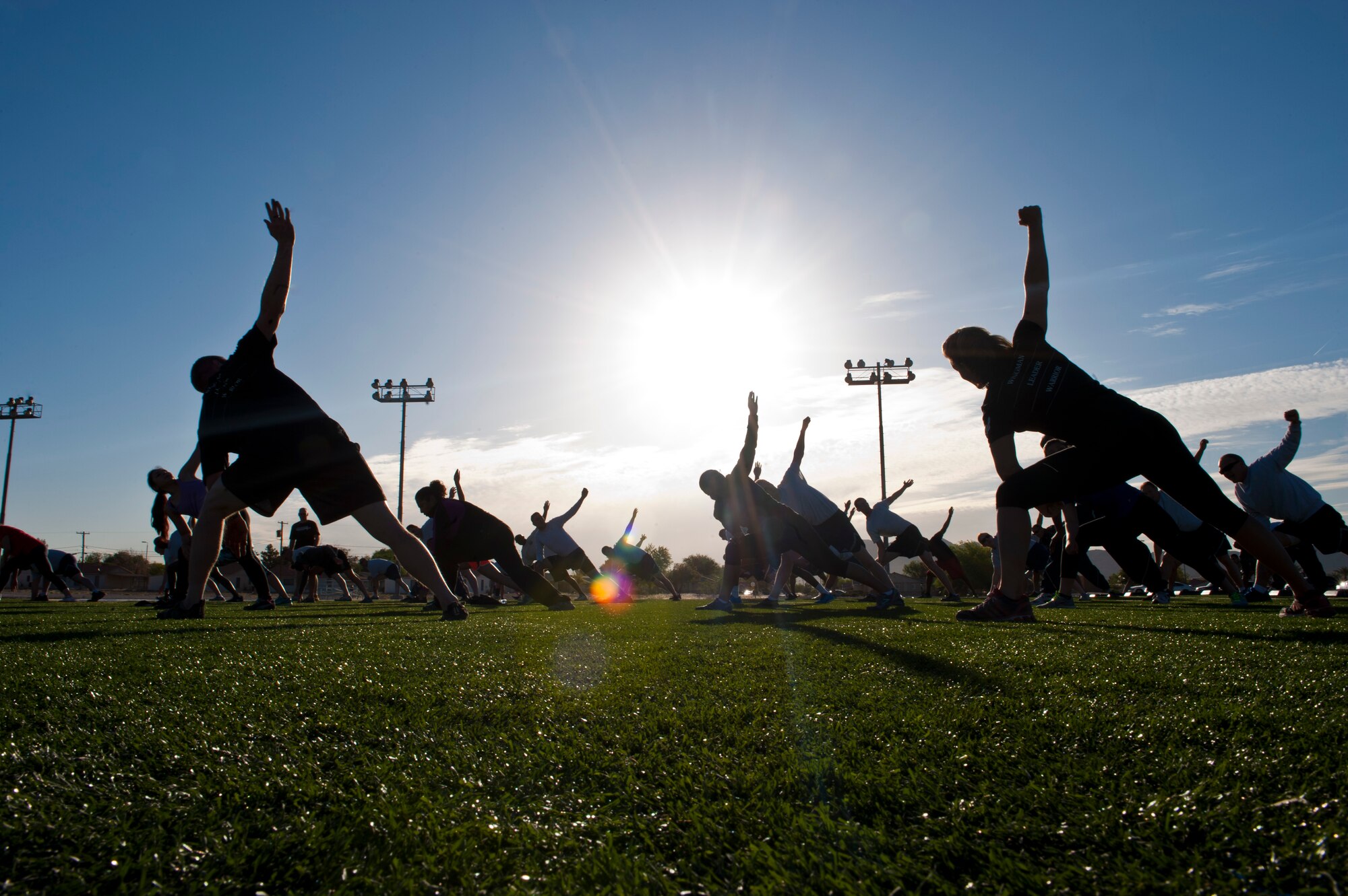 Participants warm-up before the Warrior Trained Fitness exercise session at the Warrior Fitness Center April 24, 2014, at Nellis Air Force Base, Nev. WTF is a high intensity interval training workout designed to build up cardio-vascular and muscular strength. (U.S. Air Force photo by Airman 1st Class Thomas Spangler)