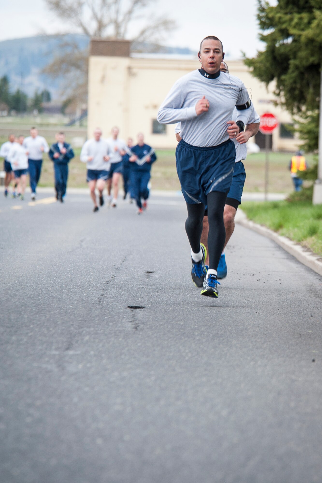 Airmen race to the finish during the 5k Sexual Assault Awareness Month road race April 25, 2014, at Fairchild Air Force Base, Wash. Participants were given the option to run either 1.5 mile or 5k races. The first 300 runners to cross the finish line were awarded a sexual assault awareness themed t-shirt. (U.S. Air Force photo by Staff Sgt. Benjamin W. Stratton/Released)