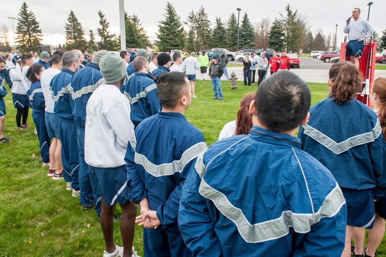 Col. Brian Newberry rallies supporters and runners alike at the start of the Sexual Assault Awareness Month road race April 25, 2014, at Fairchild Air Force Base, Wash. Participants were given the option to run either 1.5 mile or 5k races. The first 300 runners to cross the finish line were awarded a sexual assault awareness themed t-shirt. Newberry is the 92nd Air Refueling Wing commander. (U.S. Air Force photo by Staff Sgt. Benjamin W. Stratton/Released)