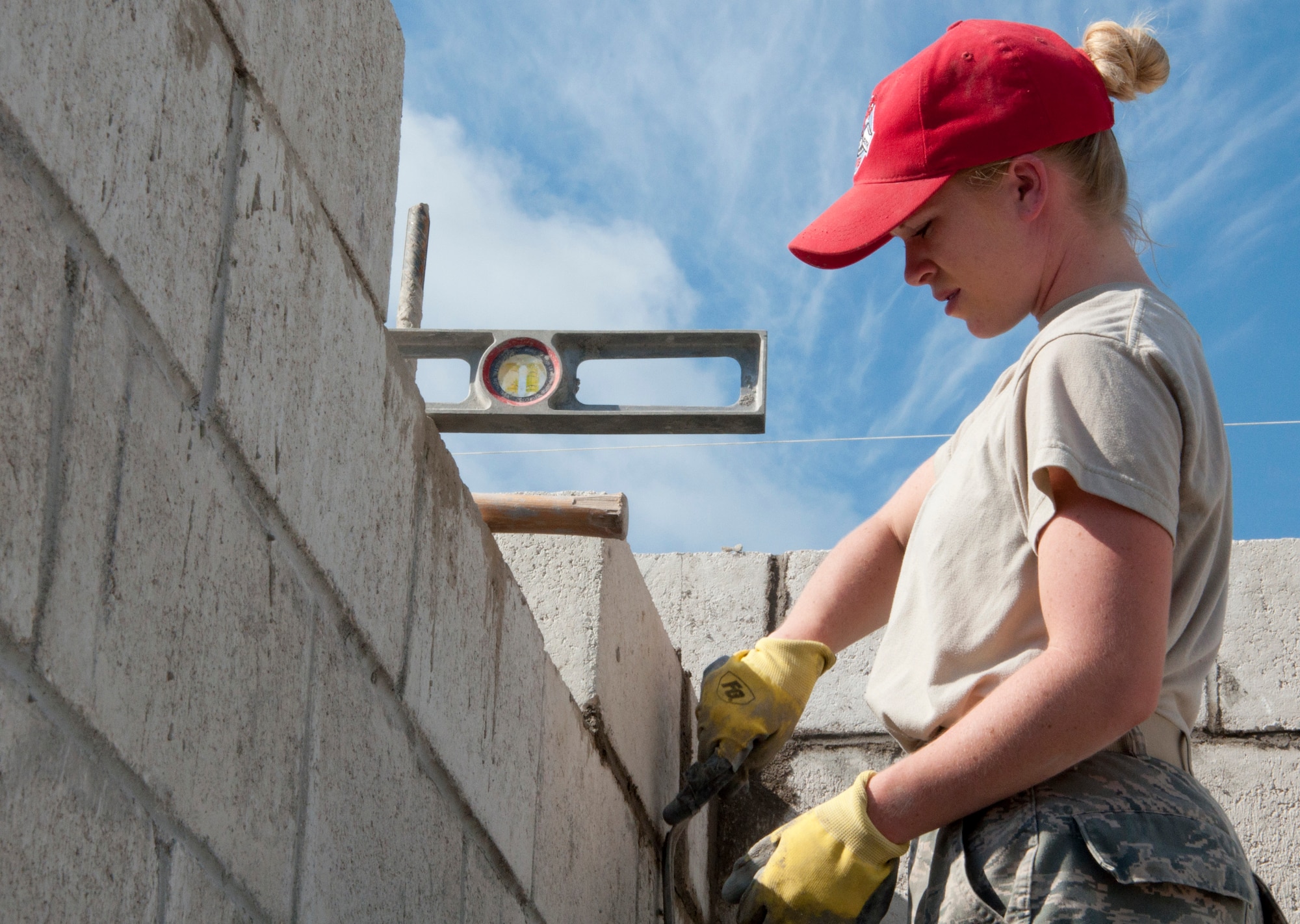 Senior Airman Alyssa Reno, a New Horizons medic deployed from the 366th Aerospace Medicine Squadron, Mountain Home Air Force Base, Idaho, assigned to the U.S. Southern Command-sponsored New Horizons exercise in Belize, lays block at the Sadie Vernon school addition construction site in Belize City, Belize, April 23, 2014. (USAF photo by Tech. Sgt. Kali Gradishar/Released)