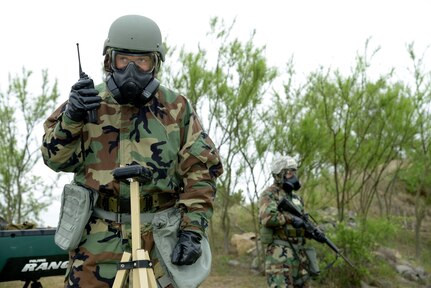 U.S. Air Force Staff Sgt. Will Hamilton left and Senior Airmen Jerry Shackelford, 559th Aerospace Medicine Squadron, Joint Base San Antonio-Lackland, take a chemical release test, after a simulated missile attack April 24, 2014 at Joint Base San Antonio-Randolph. (U.S. Air Force photo by Joel Martinez)