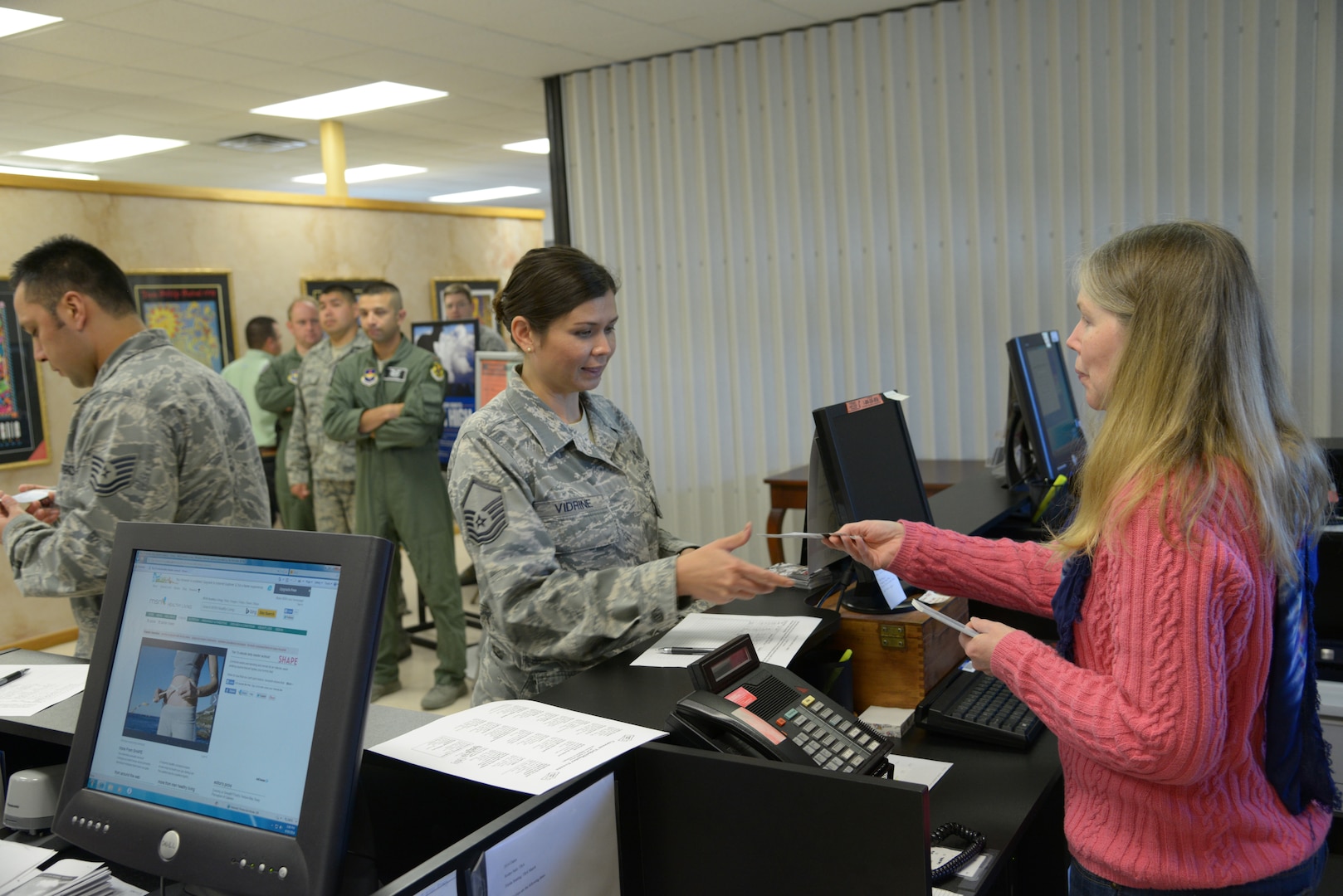 Master Sgt. Cindy Vidrine (left) purchases tickets April 17 from Jennifer Myers, Community
Services Mall employee, at Joint Base San Antonio-Randolph. (U.S. Air Force photo by Joel Martinez)