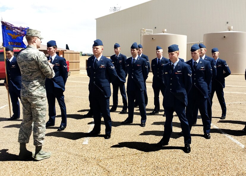 U.S. Air Force Staff Sgt. Johnathon Turner, 551st Special Operations Squadron Military Training Leader, conducts an Open Ranks inspection with his airmen at Cannon Air Force Base, N.M. Turner strives to instill within the non-prior service airmen the importance of embodying the Air Force Core Values in everything they do. (U.S. Air Force courtesy photo)