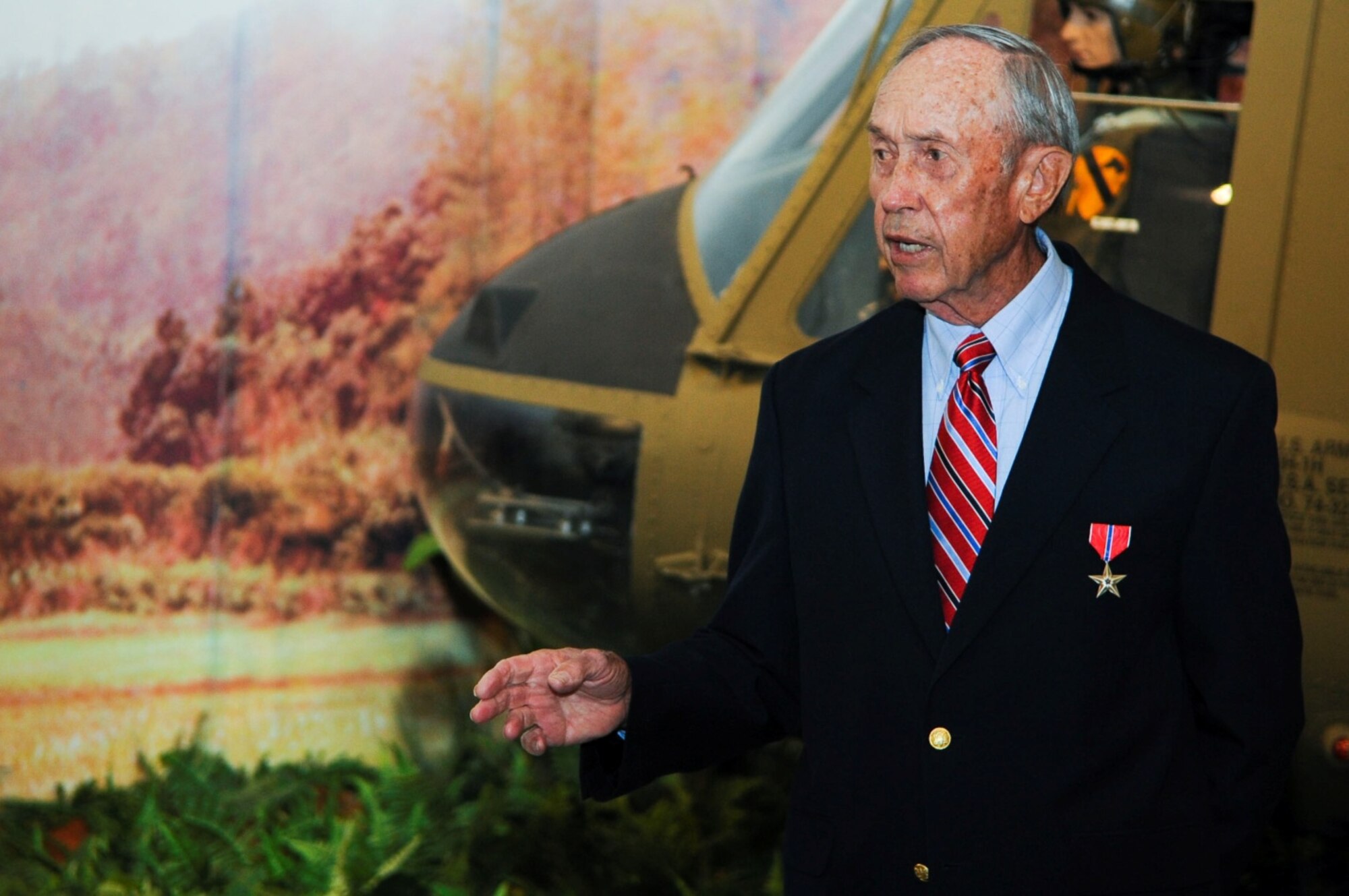 Retired U.S. Army Lt. Col. Harold Campbell, 117th Aviation Company, 140th Transportation Detachment commander, speaks during a Bronze Star presentation ceremony at Fort Eustis, Va., April 24, 2014. He received the Bronze Star for his leadership and perseverance during his deployment to Vietnam from Aug. 15, 1963 to May 1, 1964. (U.S. Air Force photo by Senior Airman Austin Harvill/Released) (photo cropped, color corrected, contrasted and sharpened for effect)