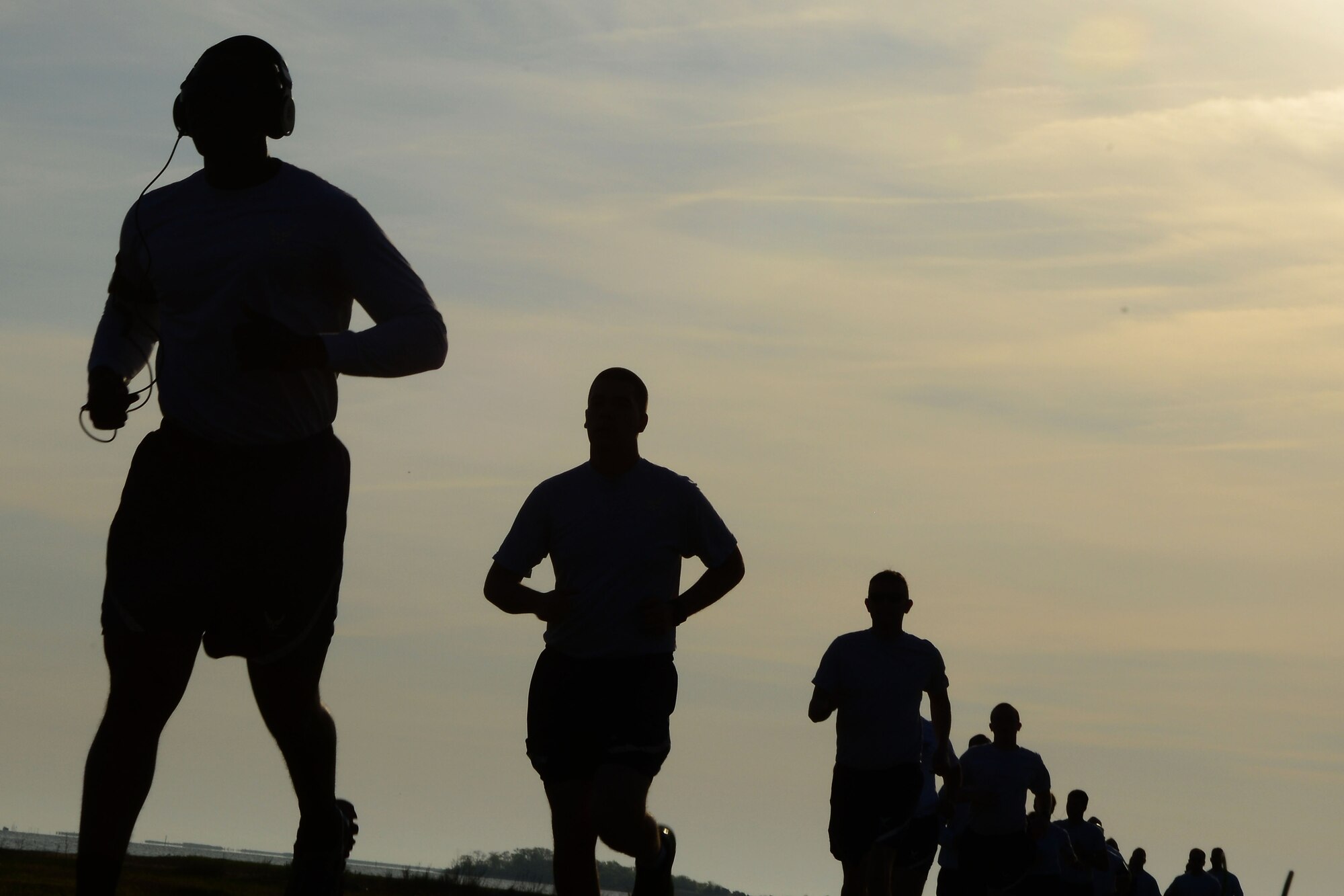 Team Langley sprints down a trail during the Annual Major Ransom Memorial 5k run at Langley Air Force Base, Virginia, April 25, 2014. The memorial run is held annually in remembrance of Maj. Charles Ransom and the NATC-A NINE. (U.S. Air Force Staff Sgt. Antoinette Gibson/Released)