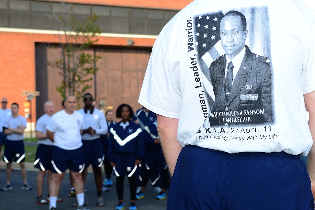 Airmen with the 83rd Network Operations Squadron came together for a command run at Langley Air Force Base, Virginia, April 25, 2014, to honor the memory of their fallen Airman. Capt. Charles A. Ransom, a cyberspace Airman assigned to the 83rd Network Operations Squadron, Langley Air Force Base, Virginia, died April 27, 2011, at the Kabul International Airport in Afghanistan of wounds suffered from gunfire while supporting Operation Enduring Freedom. (U.S. Air Force Staff Sgt. Antoinette Gibson/Released)