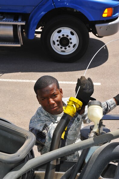 Staff Sgt. Ronald Brooks, 56th Logistics Readiness Squadron vehicle operations craftsman, performs an operations check on a vehicle at Luke Air Force Base, Ariz., April 24, 2014. Brooks lived first hand through Hurricane Katrina which topped out at Catagory 5 strength. (U.S. Air Force photo by Senior Airman Jason Colbert)