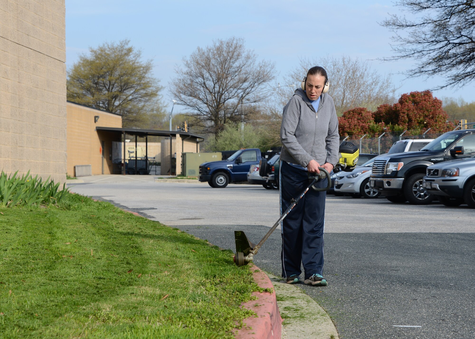 U.S. Air Force Senior Airman Sara Nittinger, 175th Civil Engineering Squadron, uses an edger April 25, 2014 during Base Beautification Day at Warfield Air National Guard Base, Baltimore, Md. Base Beautification Day gives members of the 175th Wing the opportunity to improve the cleanliness and aesthetics of their outside work areas.  (U.S. Air National Guard photo by Tech. Sgt. Chris Schepers/RELEASED)