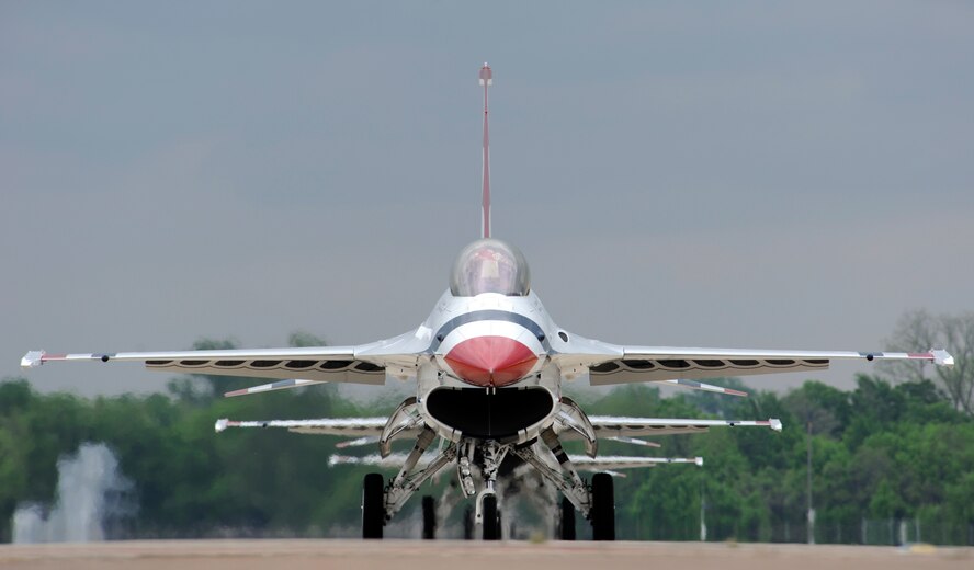 The U.S. Air Force Thunderbirds F-16 Fighting Falcons taxi off the runway at Barksdale Air Force Base, La., April 24, 2014. The Thunderbirds will be the headlining act for the 2014 Defenders of Liberty Air Show. (U.S. Air Force photo/Senior Airman Joseph A. Pagán Jr.)