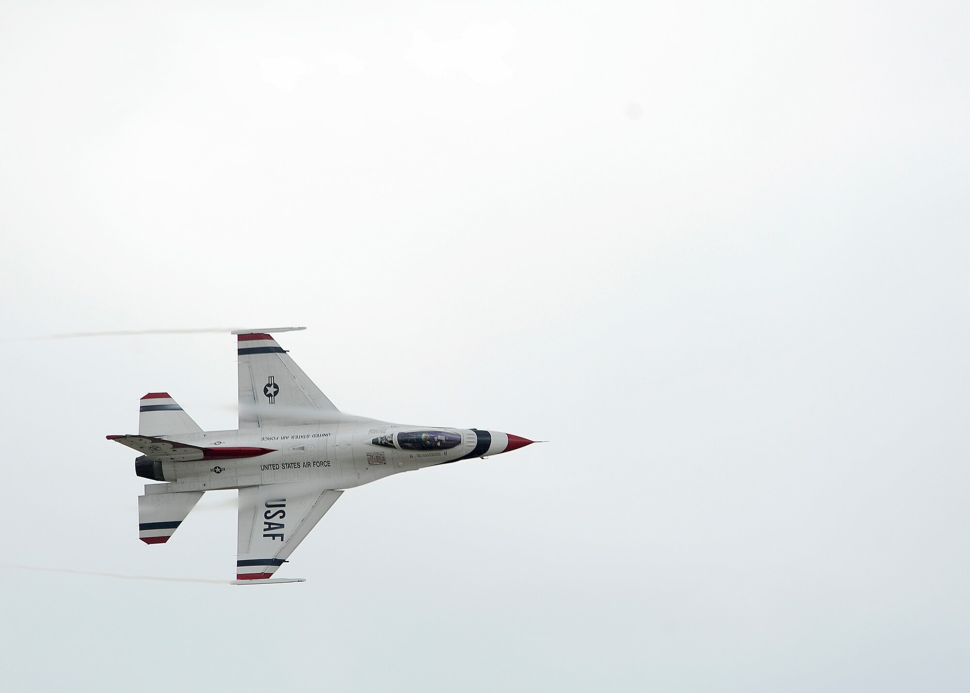 A U.S. Air Force Thunderbirds F-16 Fighting Falcon performs an aerial maneuver in preparation for the 2014 Defenders of Liberty Air Show at Barksdale Air Force Base, La., April 24, 2014. The annual air show will feature several aerial demonstration acts, headlined by Thunderbirds. (U.S. Air Force photo/Senior Airman Joseph A. Pagán Jr.)