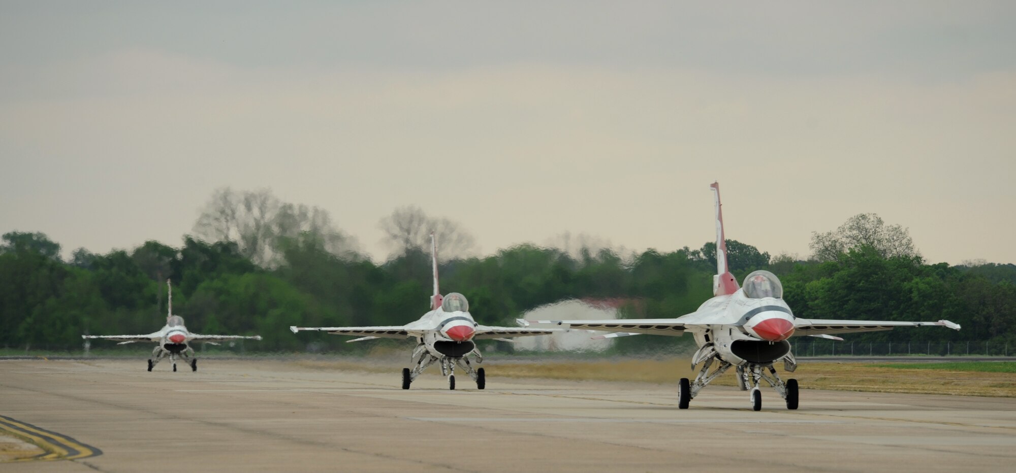U.S. Air Force Thunderbirds F-16 Fighting Falcons taxi off the runway on Barksdale Air Force Base, La., April 24, 2014. The Thunderbirds, based at Nellis Air Force Base, Nev., is the Air Force's premier aerial demonstration team, performing at air shows and special events worldwide. (U.S. Air Force photo/Senior Airman Benjamin Gonsier)
