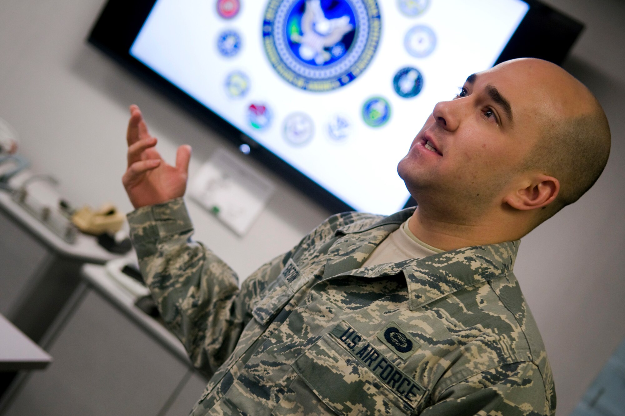 Senior Airman Jared Easton, 434th OSS intelligence apprentice, practices giving an intelligence briefing at Grissom Air Reserve Base, Ind., March 26, 2014. The 434th OSS intelligence office was recently named the Air Force Reserve's Outstanding OSS Intelligence Surveillance and Reconnaissance Unit of the Year for 2013. (U.S. Air Force photo/Tech. Sgt. Mark R. W. Orders-Woempner) 
